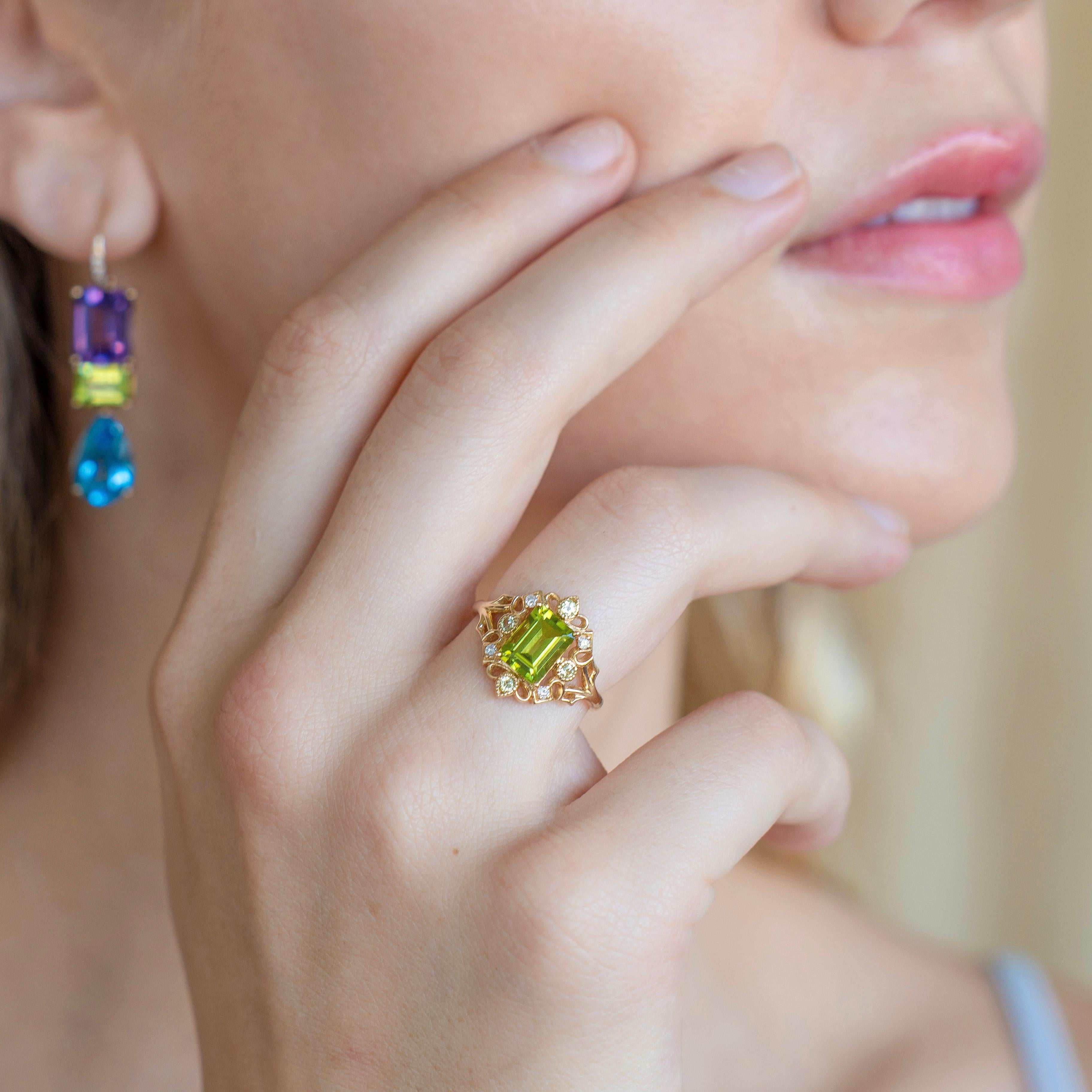 Inspired by vintage artistry, the Renaissance Peridot Diamond Cocktail Ring brings an old-world charm to modern elegance. A striking emerald-cut peridot sits at the center, glowing with a fresh green hue, framed by round peridot accents and