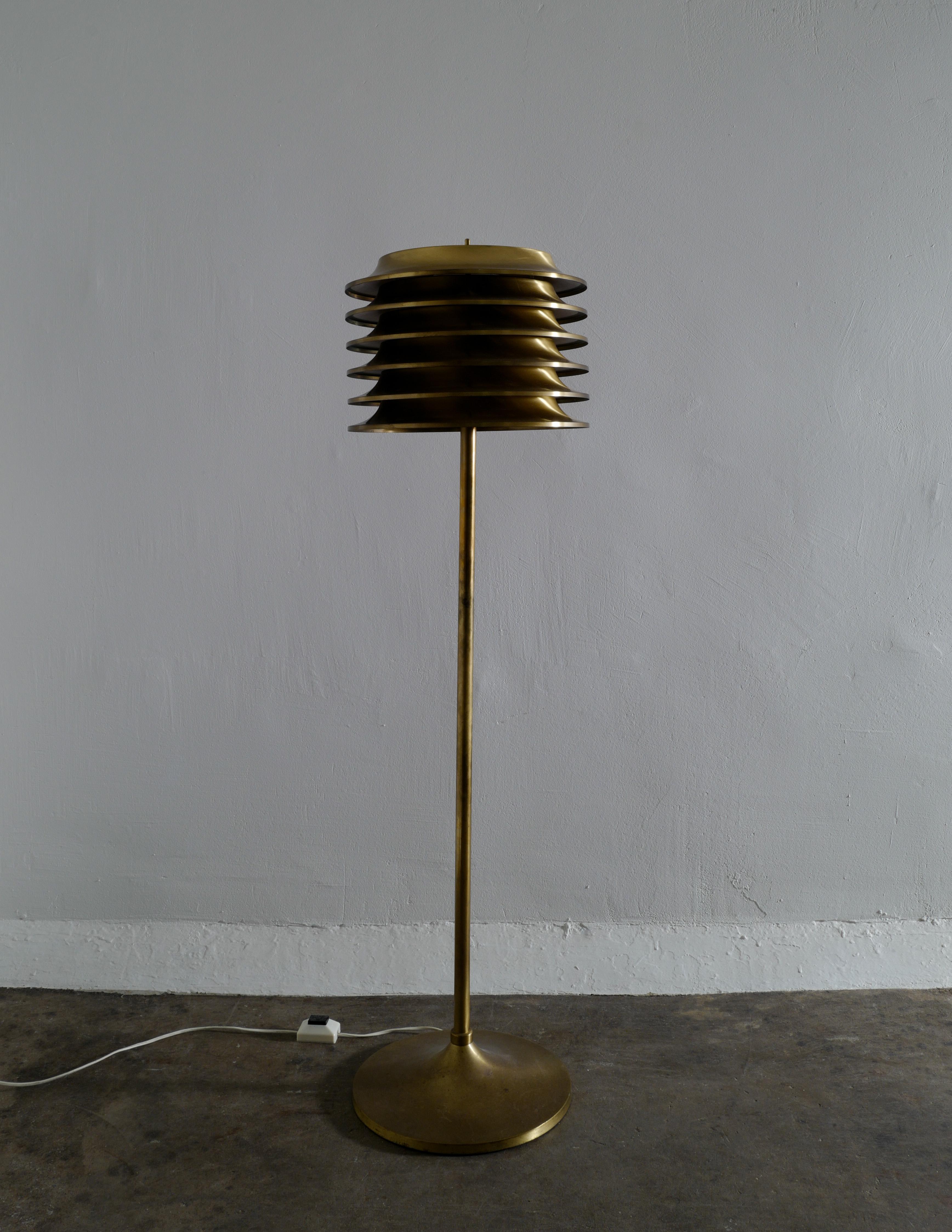 Rare floor lamp in brass designed by Kai Ruokonen and produced by Orno Oy in Finland early 1970s. Two lamps available and both are in original condition and showing beautiful patina from age and use.