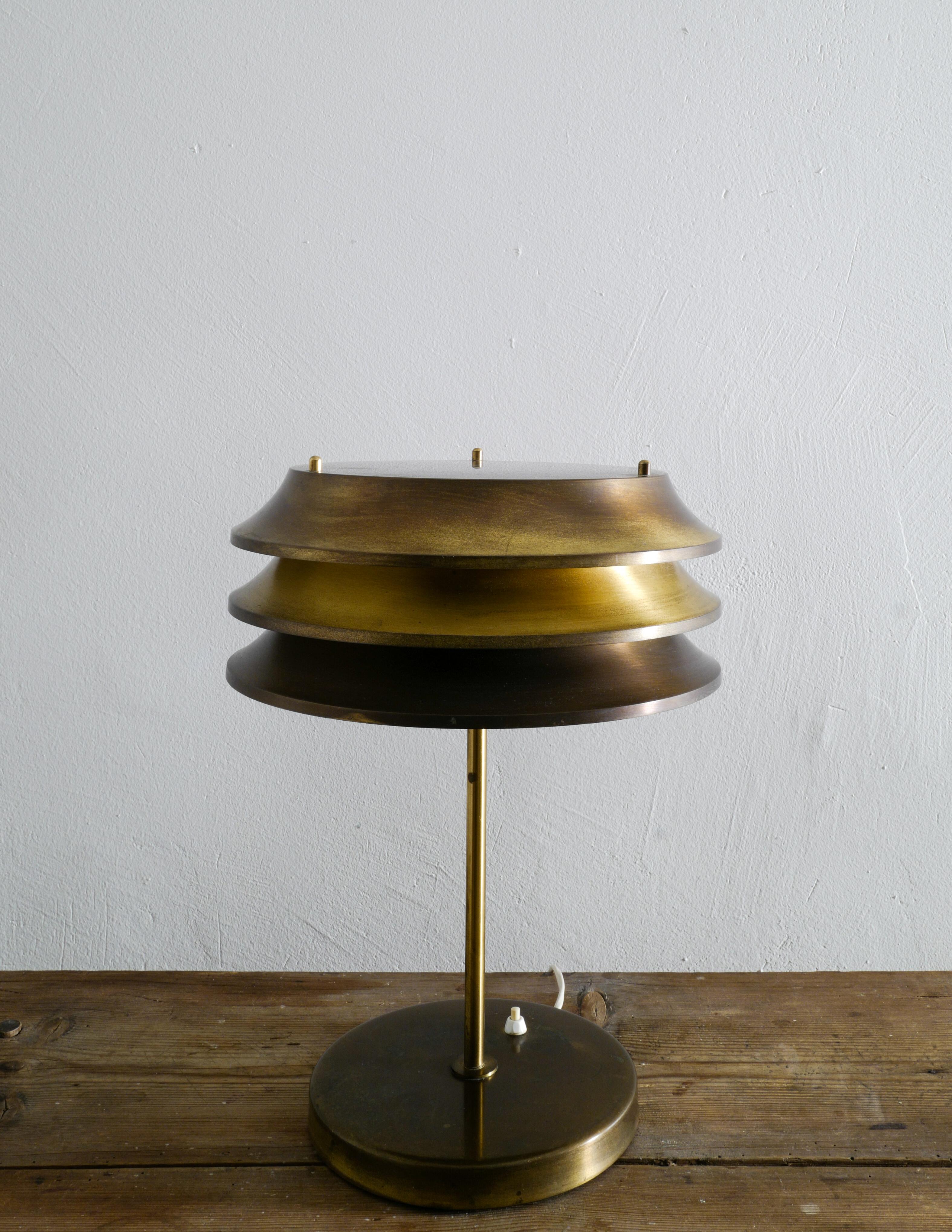 Very rare table lamp in brass designed by Kai Ruokonen and produced by Orno Oy in Finland during the 1970s. In good original vintage condition showing beautiful patina from use and age.