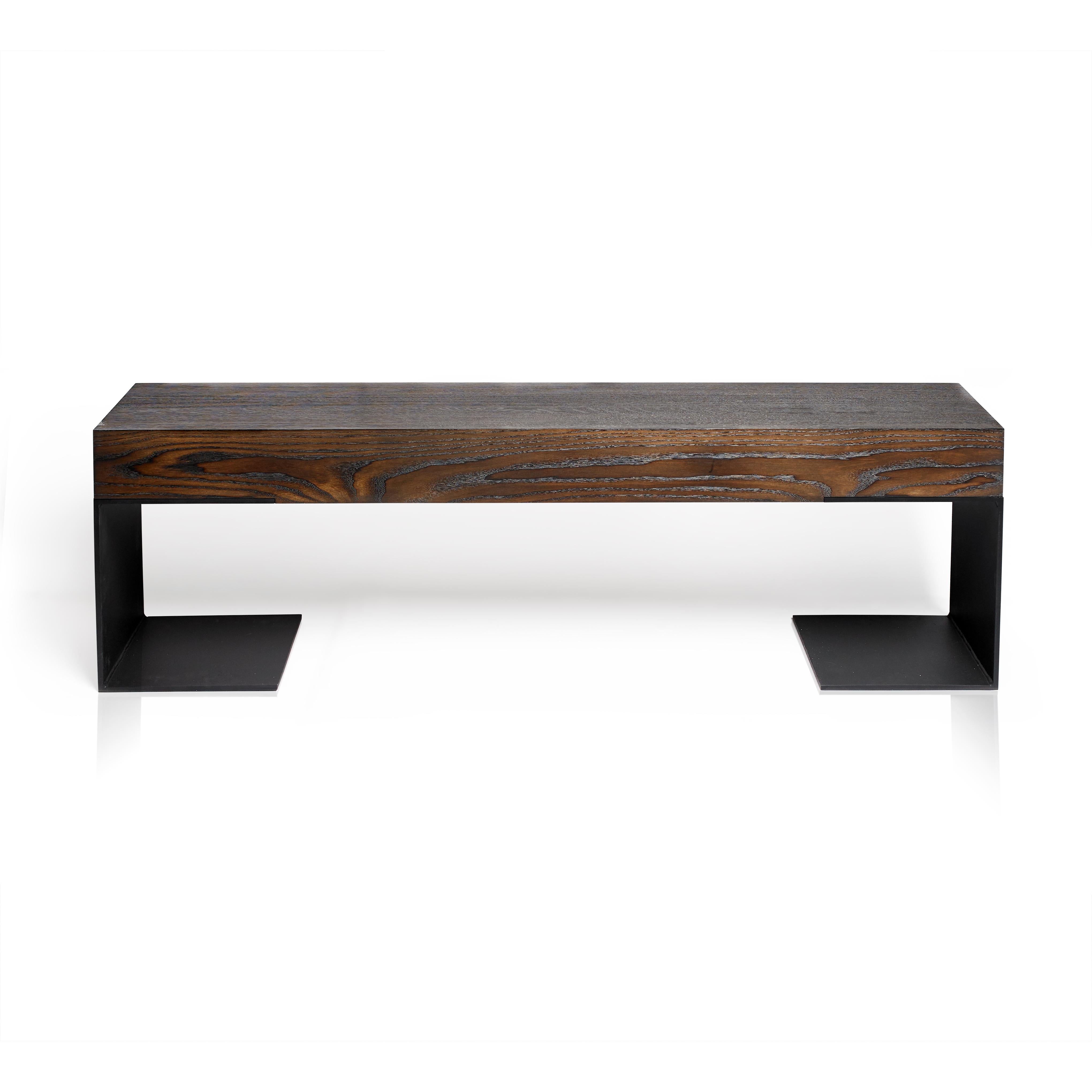 Modern industrial. The Kai Hallway bench is all about proportions, balancing the width of the steel legs and the thickness of the bench seat. It provides a modern industrial look using Torched Oak lamination's set on black steel legs. Designed by