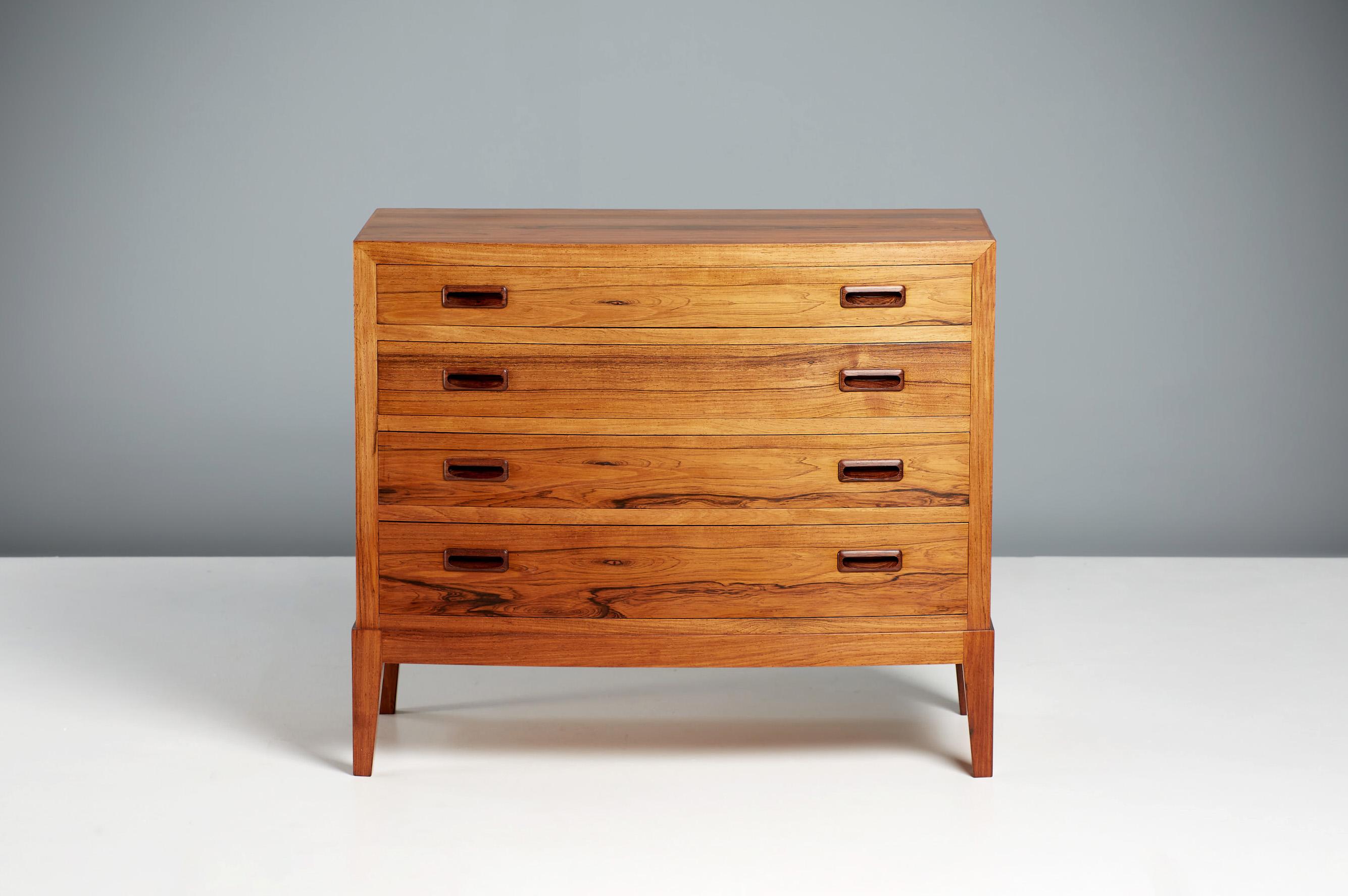 Kai Winding Chest of Drawers, circa 1960s

A low dresser from Danish cabinetmaker Kai Winding in light rosewood with exquisite grain. The frame and drawer pulls are made from solid rosewood.