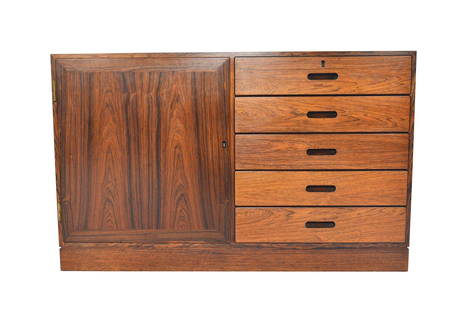 This stunning Danish modern midcentury credenza dates to the 1960s and is perfectly sized for any modern home. Crafted in Brazilian rosewood, this gorgeous piece was designed by Kai Winding for Poul Jeppesen Mobelfabrik. This credenza features a