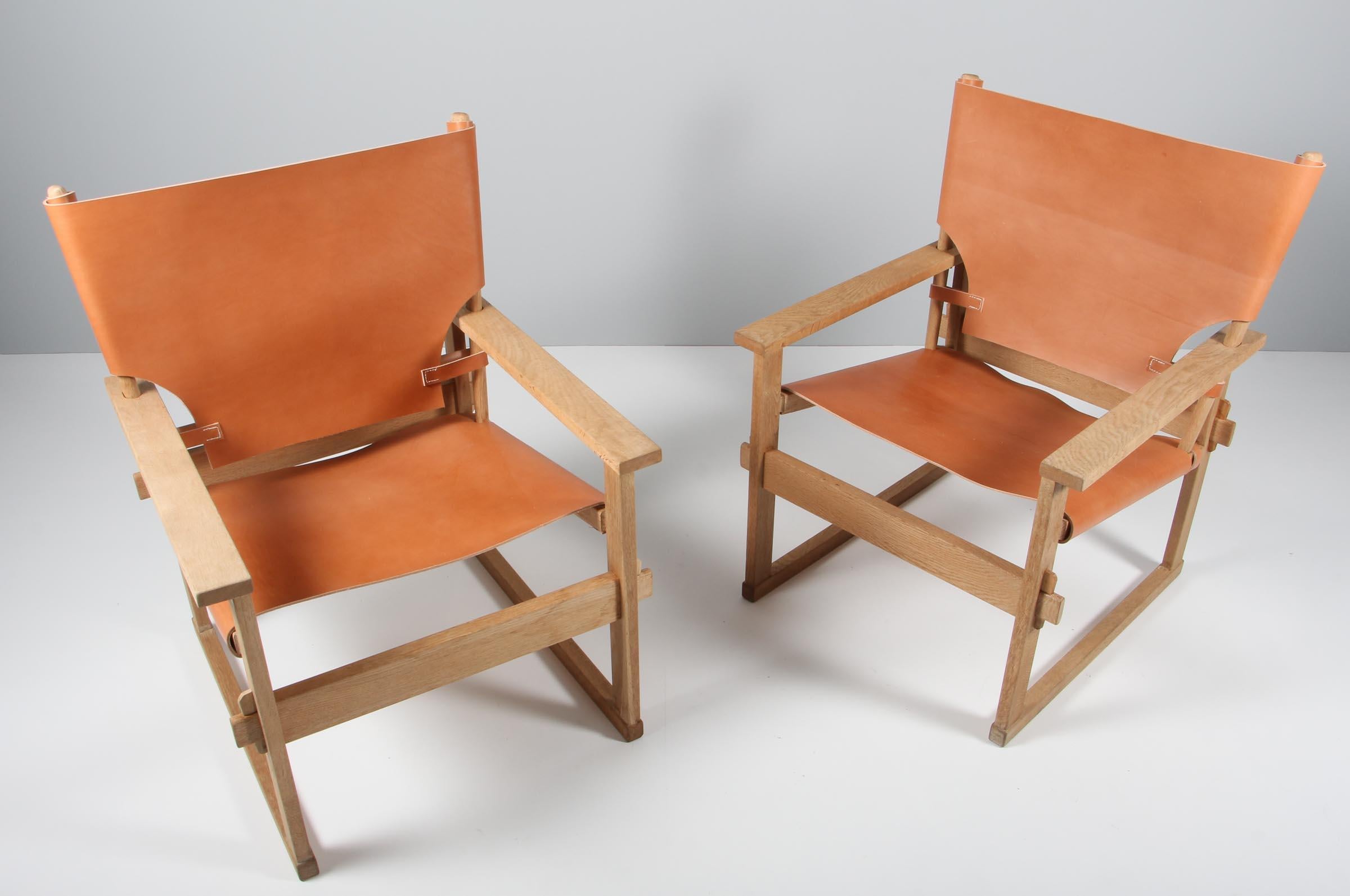 Kai Winding Safari / safari chair, frame of oak.

New upholstered with saddle leather.

Made by Poul Hundevad.