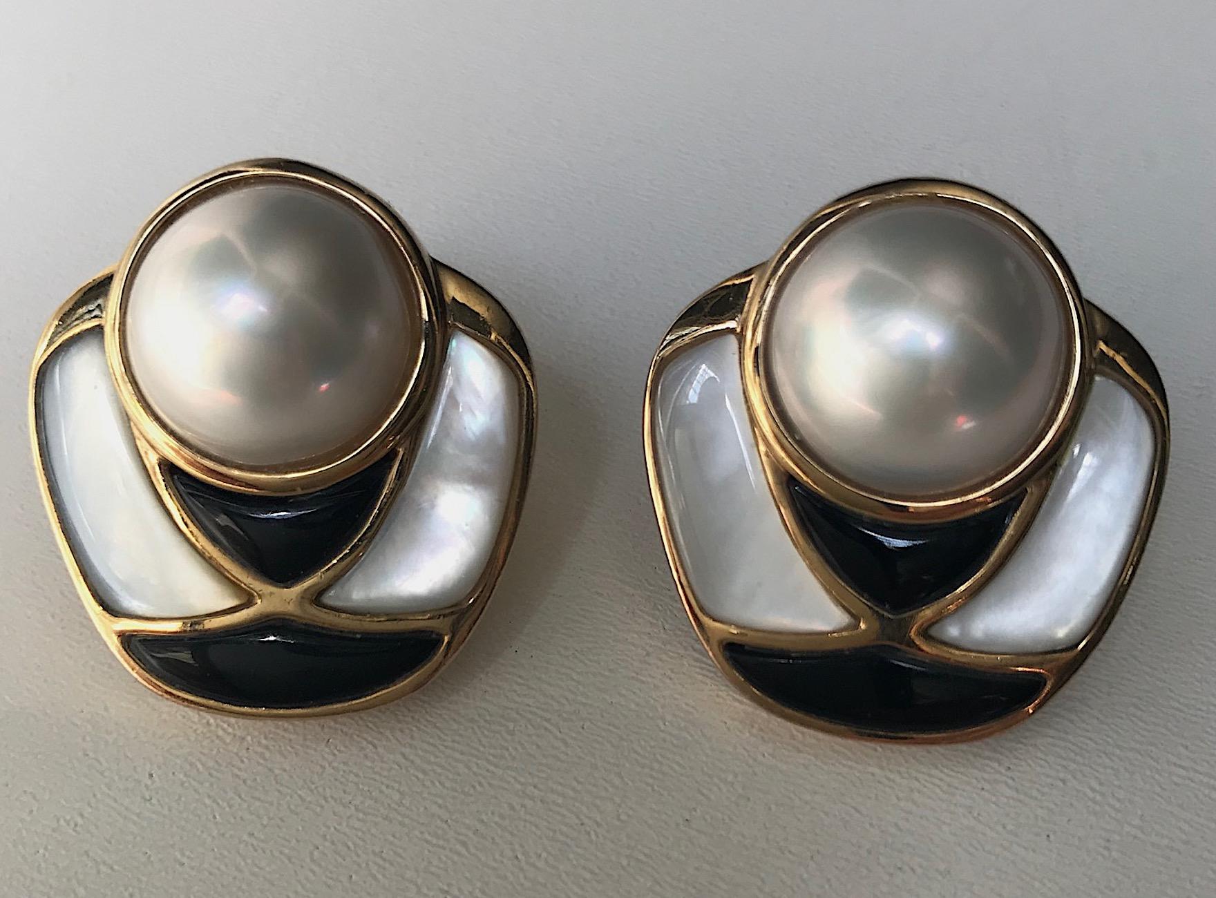 A beautifully and excellently crafted pair of earrings by international jewelry designer Kai-Yin Lo. Each earrings is comprised of a large 14 mm mabe pearl set into a vermeil (gold on sterling silver) setting. The pearl is surrounded along the sides