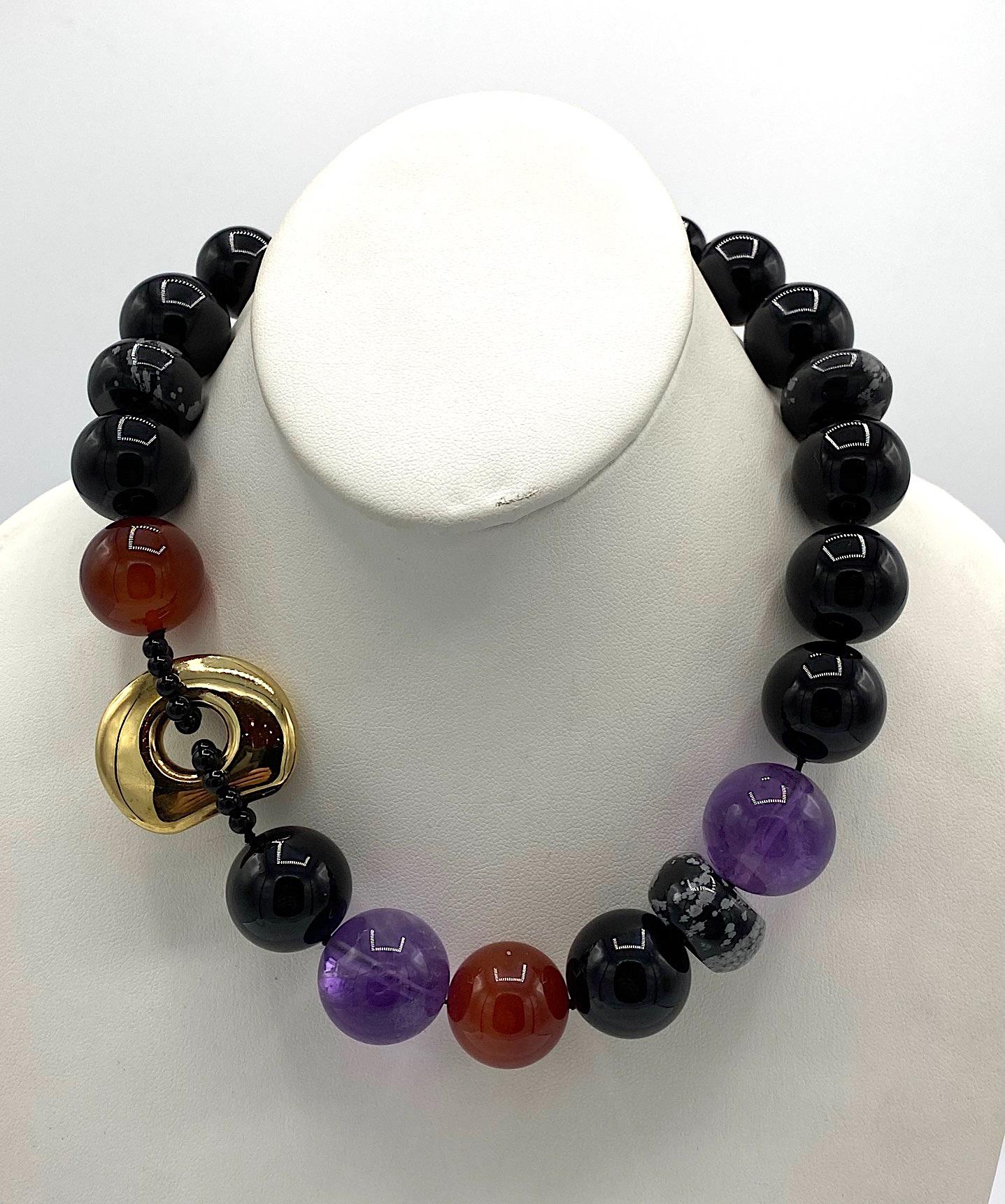 An elegant and striking strand of large semi precious beads with a gold on sterling silver vermeil decorative ring by Kai-Yin Lo. The necklace measures 18 inches long and has a gold on sterling silver hook and eye clasp. The hook is stamped Kylo and