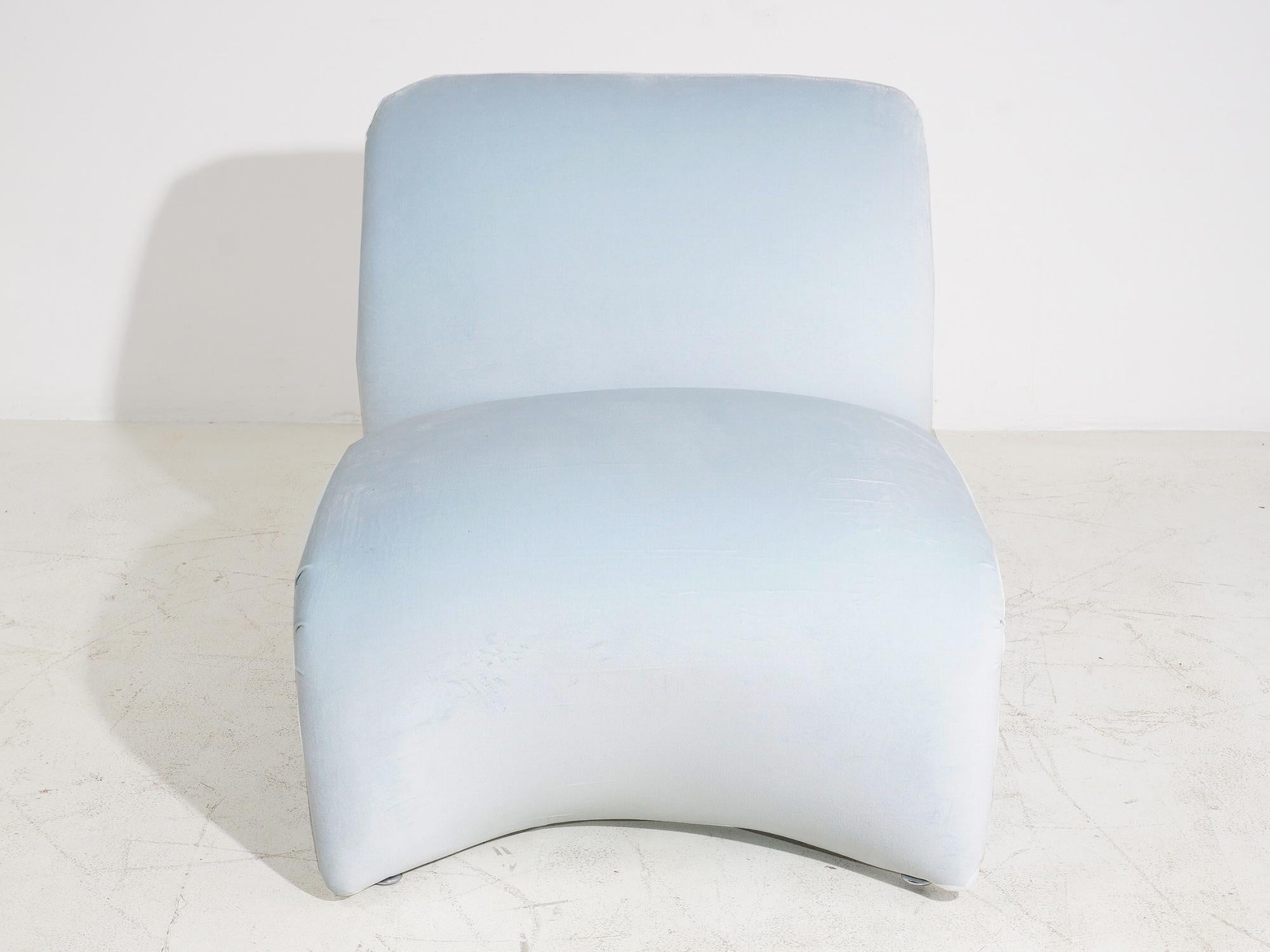 Kick back in this low sculptural lounger and look sublime from every angle. A shape like this was no doubt born circa 1960s, but the baby blue velvet upholstery is brand new. 

- 26.5