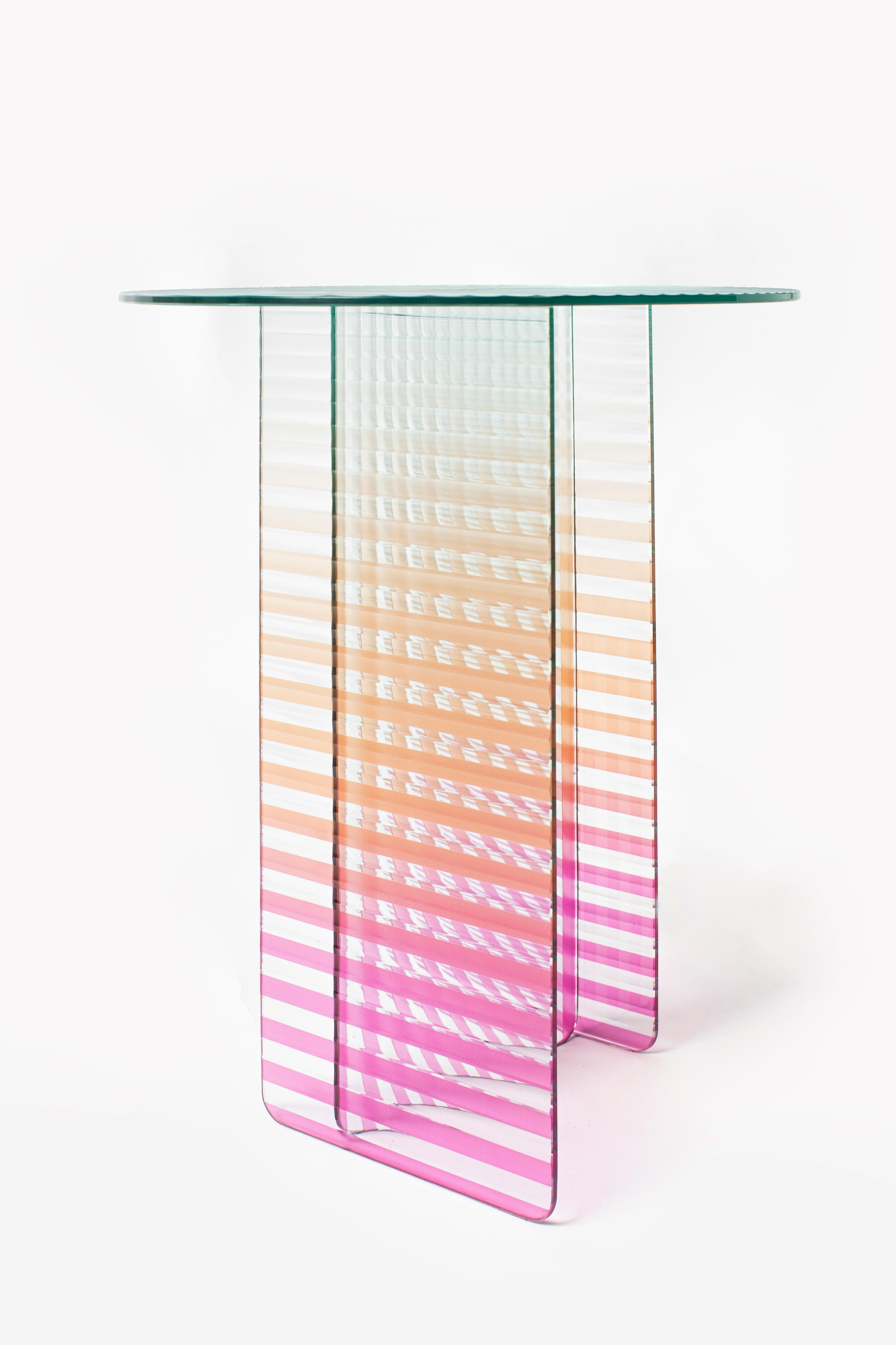 Kaila Small Side Table by Yugen Lab
Dimensions: Ø 40 x H 47 cm.
Materials: 6mm tempered ribbed glass.

Kaila Small side table boasts an elegant ribbed glass design with carefully chosen gradient colors, adding a maximalist touch. Legs, colored with