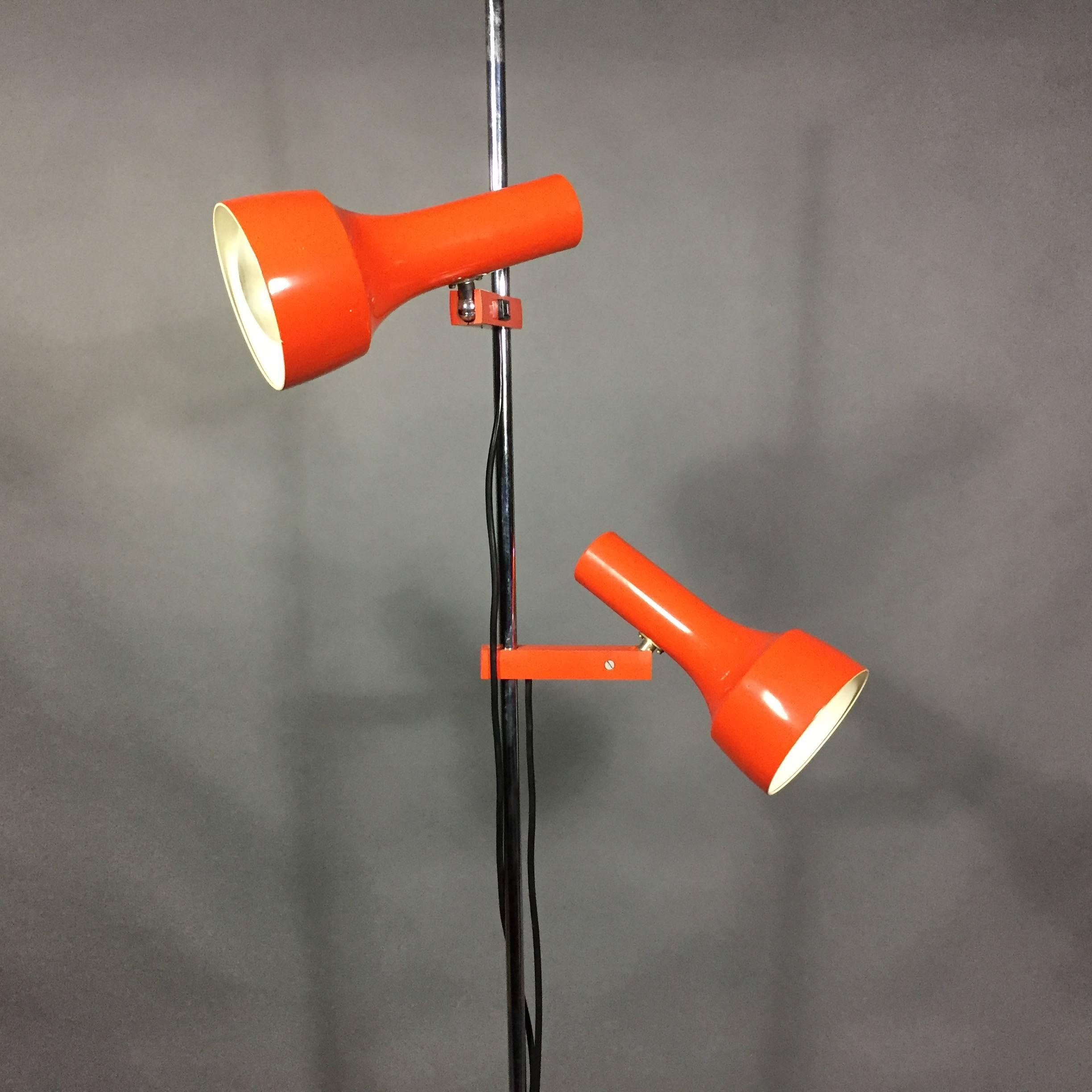 The fun side of midcentury lighting design at its best, with a double-shade lacquered metal in perfect orange by Kaiser Dell in Germany. Each shade is connected with lacquered metal posts that are moveable up and down the chrome post and are both