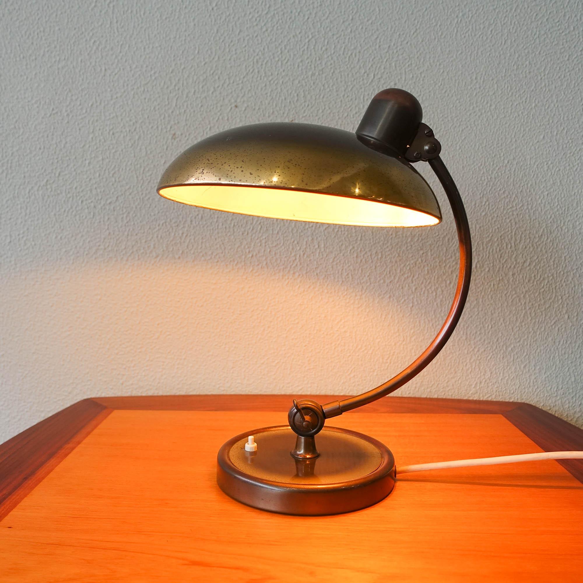 This table lamp, model 6631-T Luxus, was designed by Christian Dell for Kaiser Idell, in Germany, during the 1950's. It is with original old brass polished finishing. In very good vintage condition.