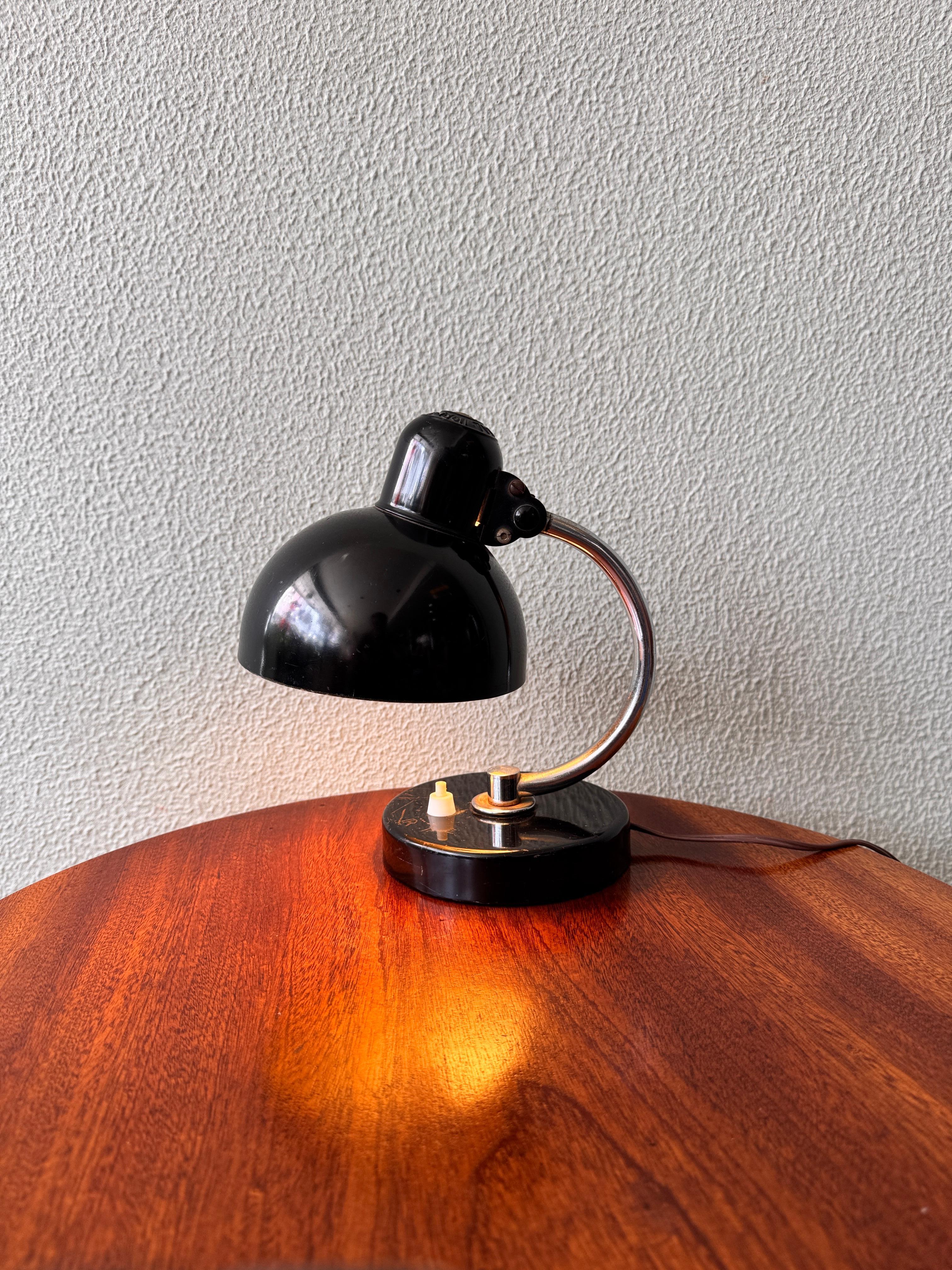 The Kaiser Idell 6722-T Table Lamp, commonly known as the 
