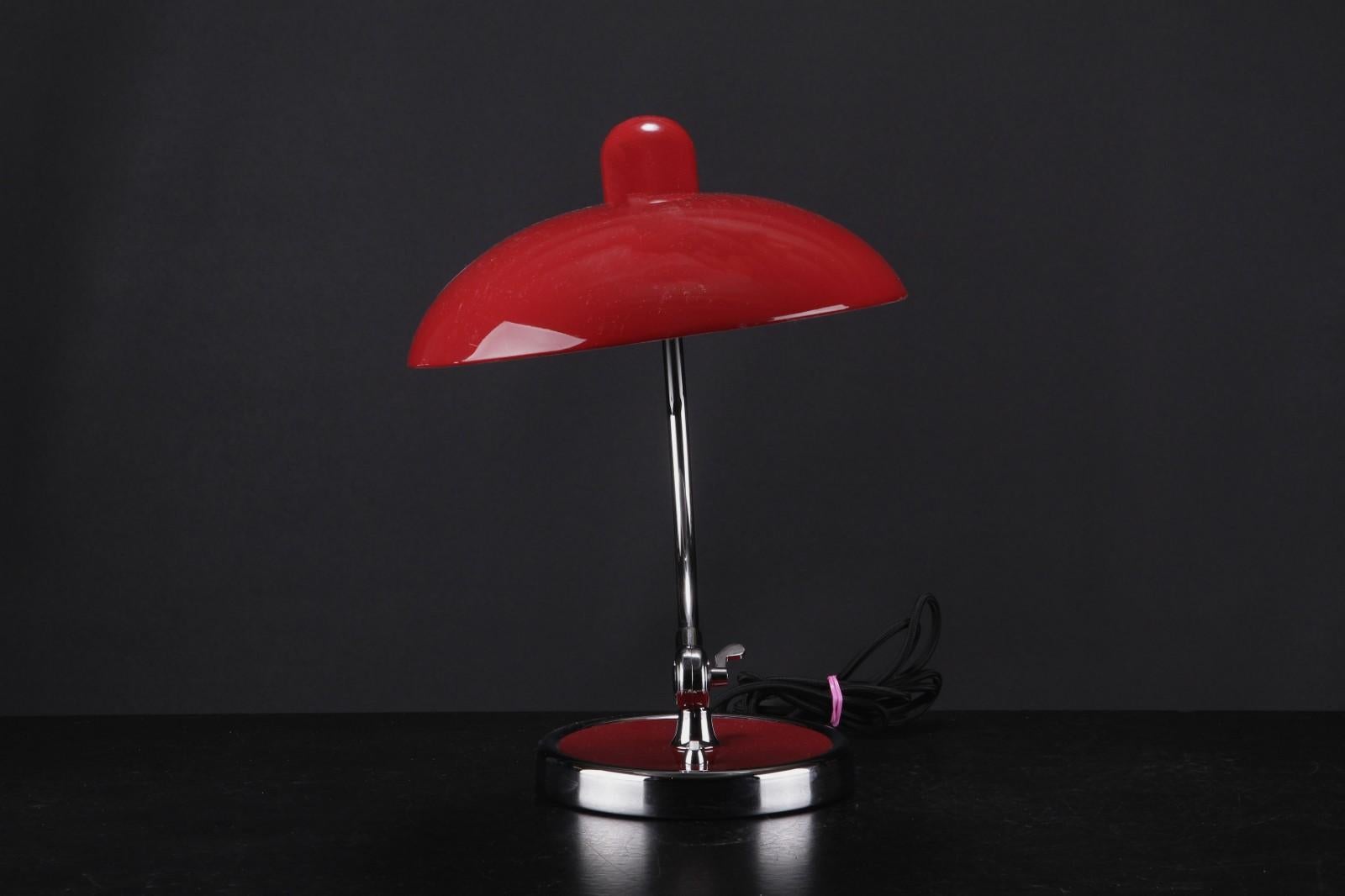 Christian Dell. Kaiser table lamp, model President of chromed and varnished metal, color: Red High Gloss. Designed in association with Bauhaus in the 1930s. Model No. 6631. H. ca. 43 cm. Ø screen 29 cm. 
Delivery time about 2-3 weeks.