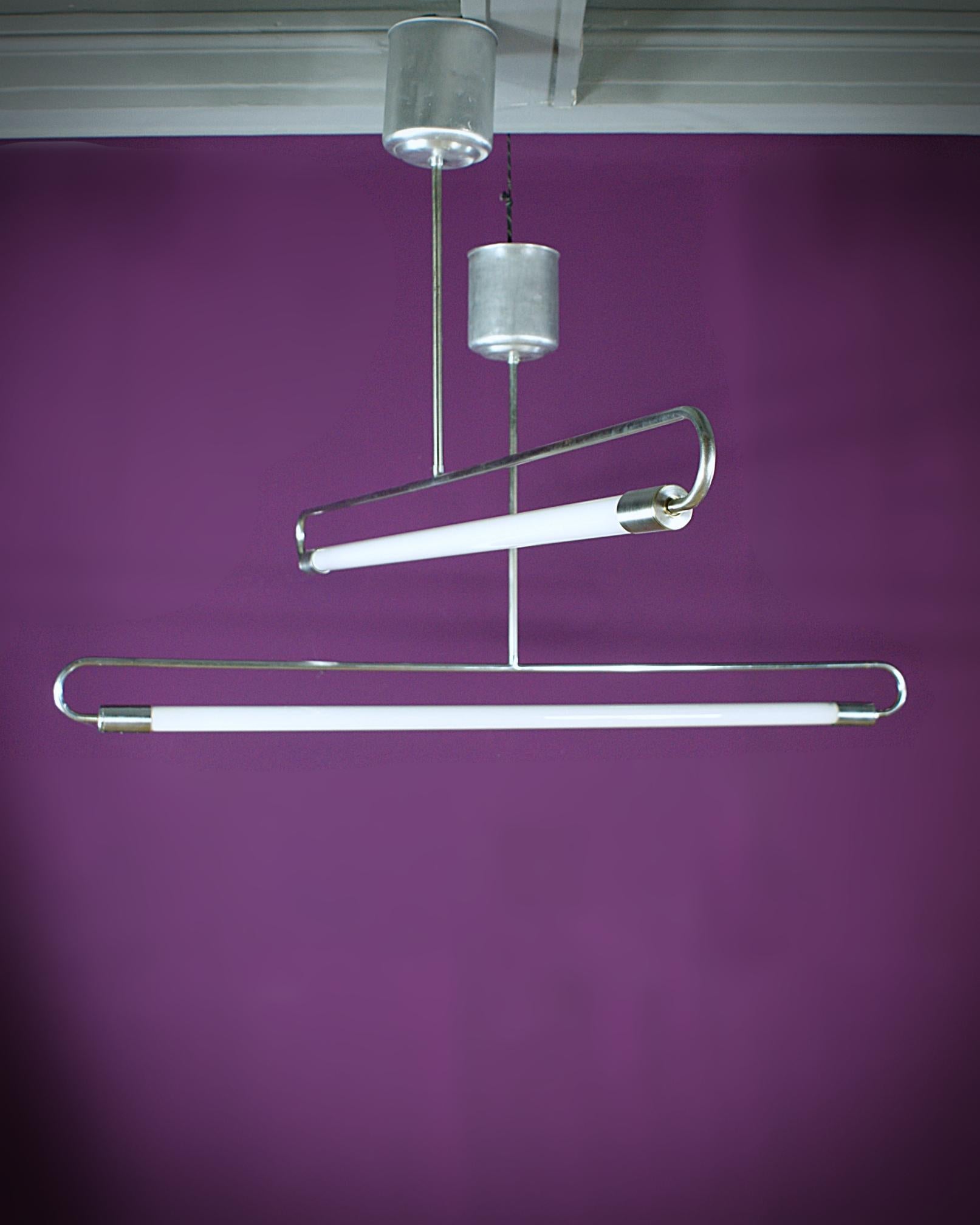 Beautiful slim line Bauhaus ceiling lamp manufactured by Kaiser Idell (Kaiser & Co Leuchten, Germany est. 1865). 
Brushed metal and alloy. 
Fully working and tested condition, rebuilt on LED - the lamp works on 220V and 110V. 
Two in stock!