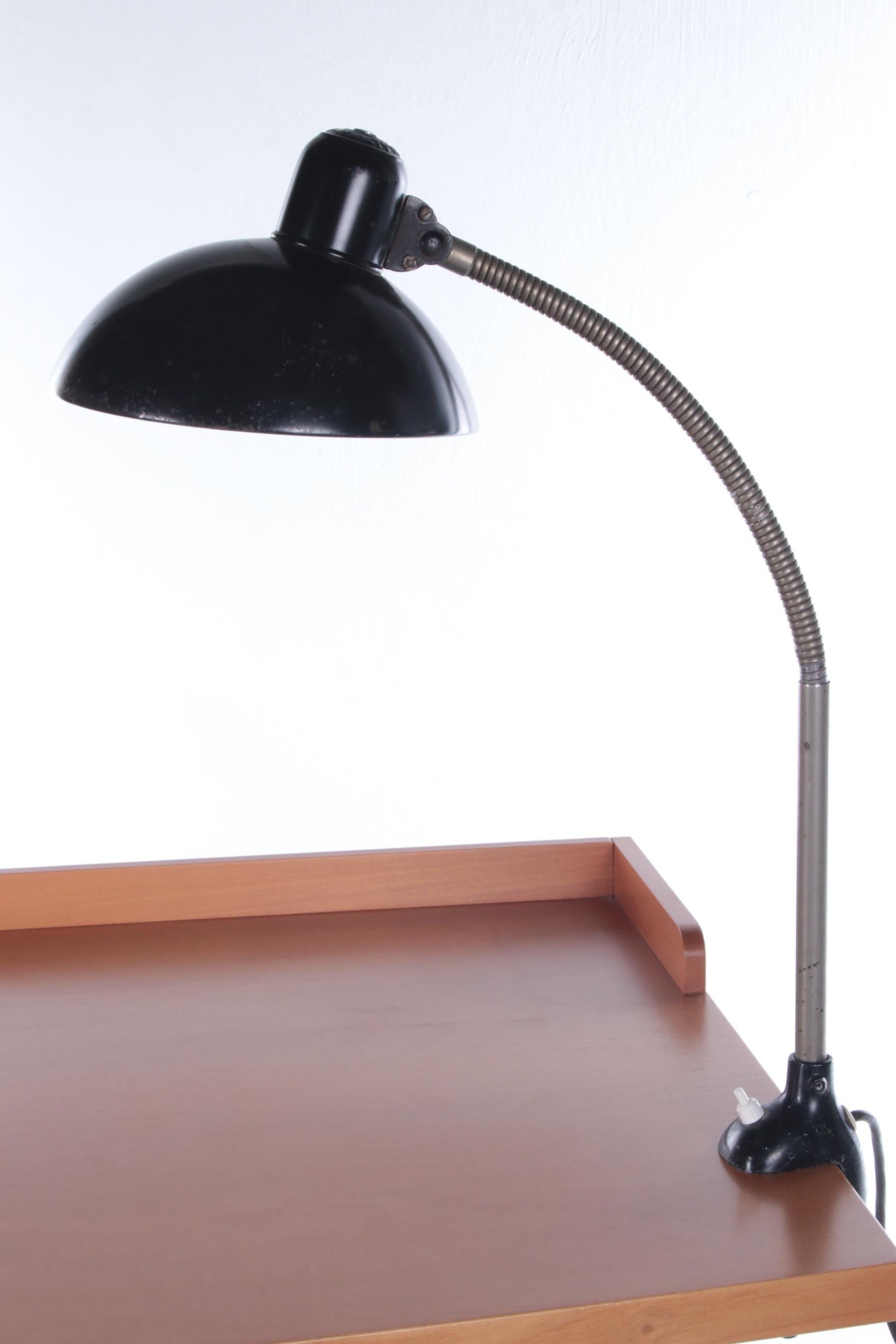 Kaiser idell desk lamp Model 6740 by Christiaan Dell


This is a Bauhaus 6740. Design Christian Dell, 1950. Christian Dell was a silversmith and foreman of the metal workshop at the Bauhaus in Weimar. His lighting designs for the lamp factory