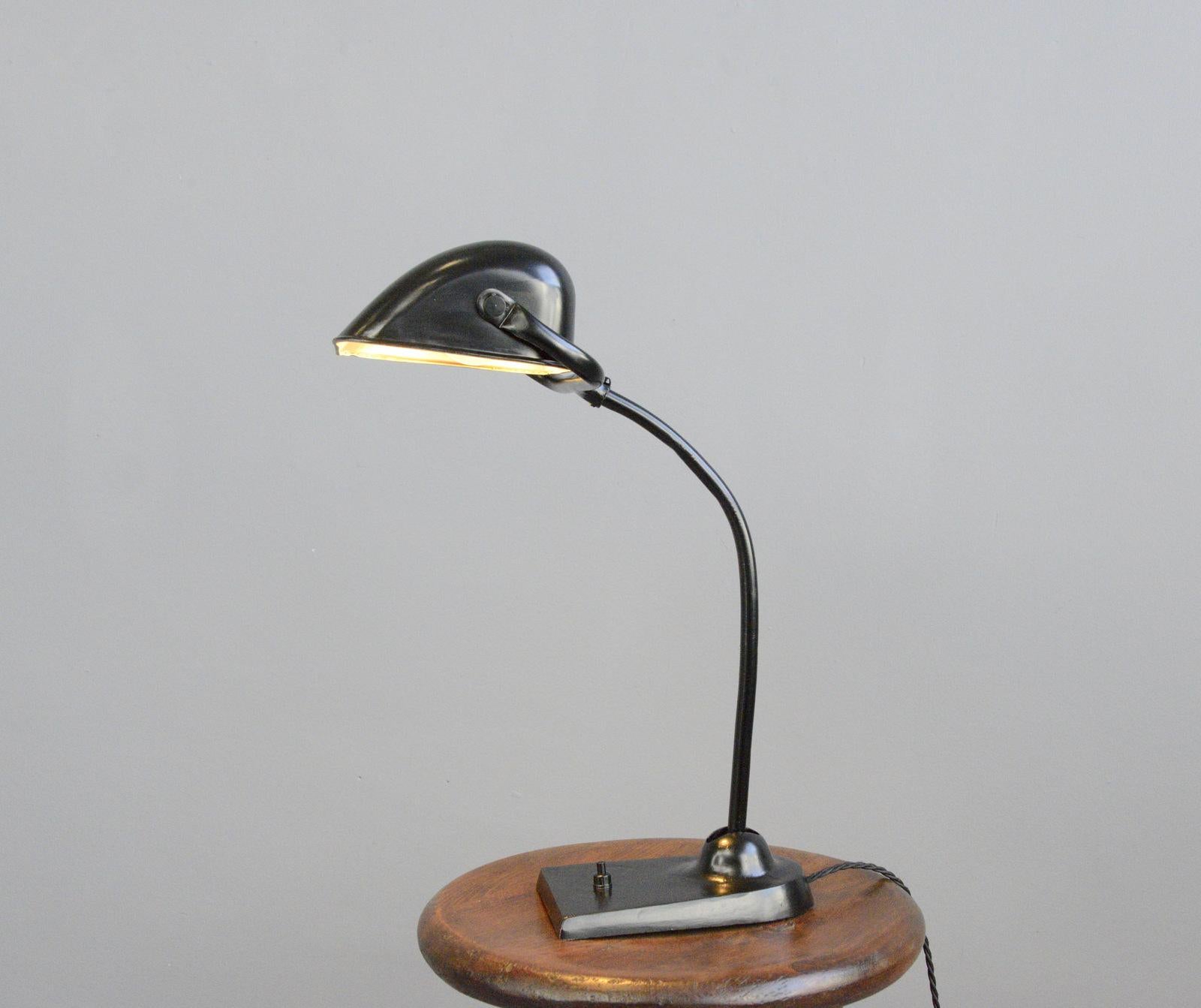 Kaiser Idell model 6617 table lamp, circa 1930s

- Cast iron base
- Adjustable arm and shade
- Takes E27 fitting bulbs
- Designed by Christian Dell
- Model 6617
- Produced by Kaiser Idell, Neheim
- German, 1930s
- Size: 46cm tall x 36cm