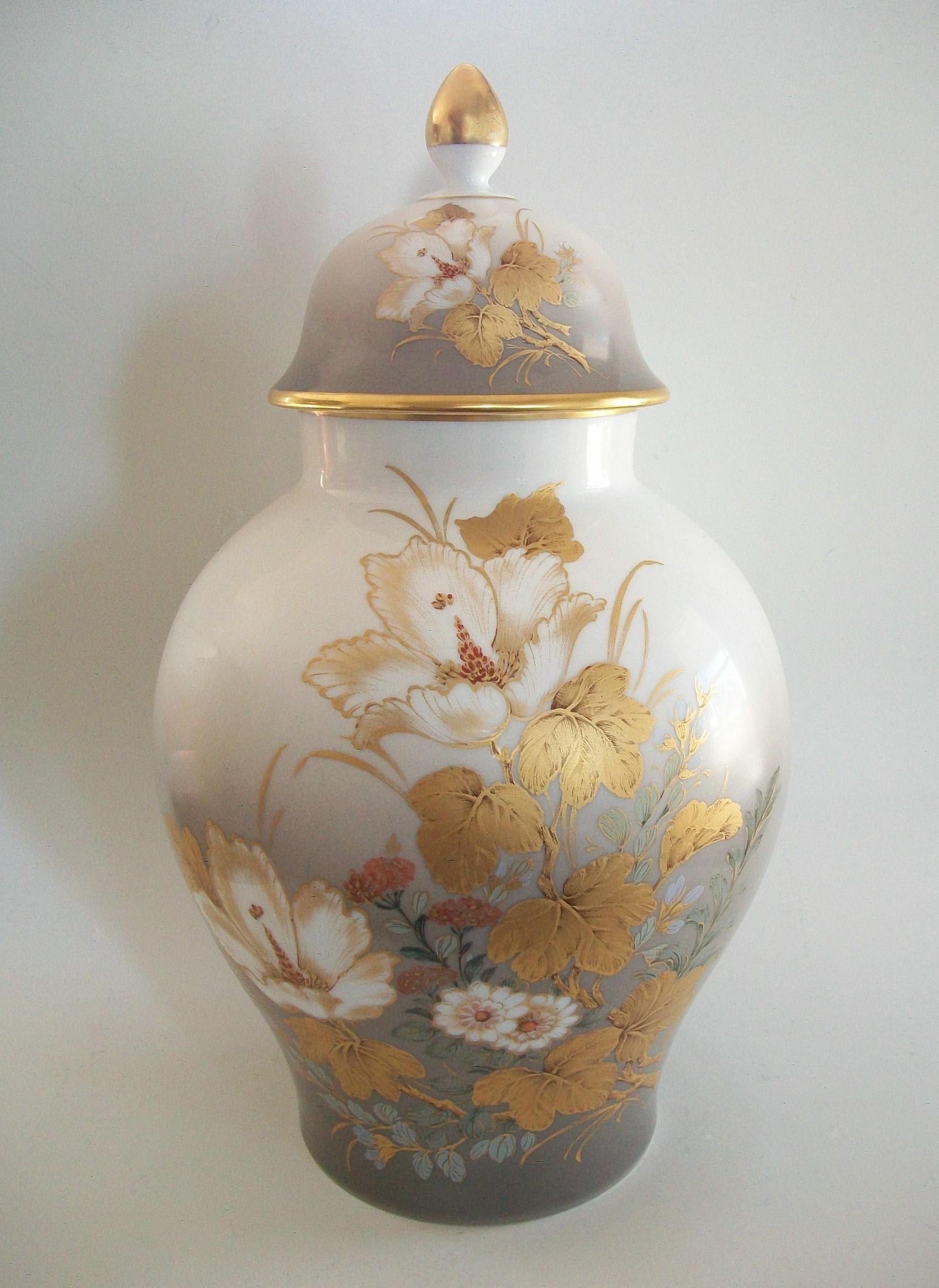 KAISER (manufacturer) - K. Nossek (designer) - Desiree (product line) - vintage fine porcelain urn and cover - featuring shaded enamels and floral decoration with gilded highlights all on a white ground - floral decoration to the back and lid -