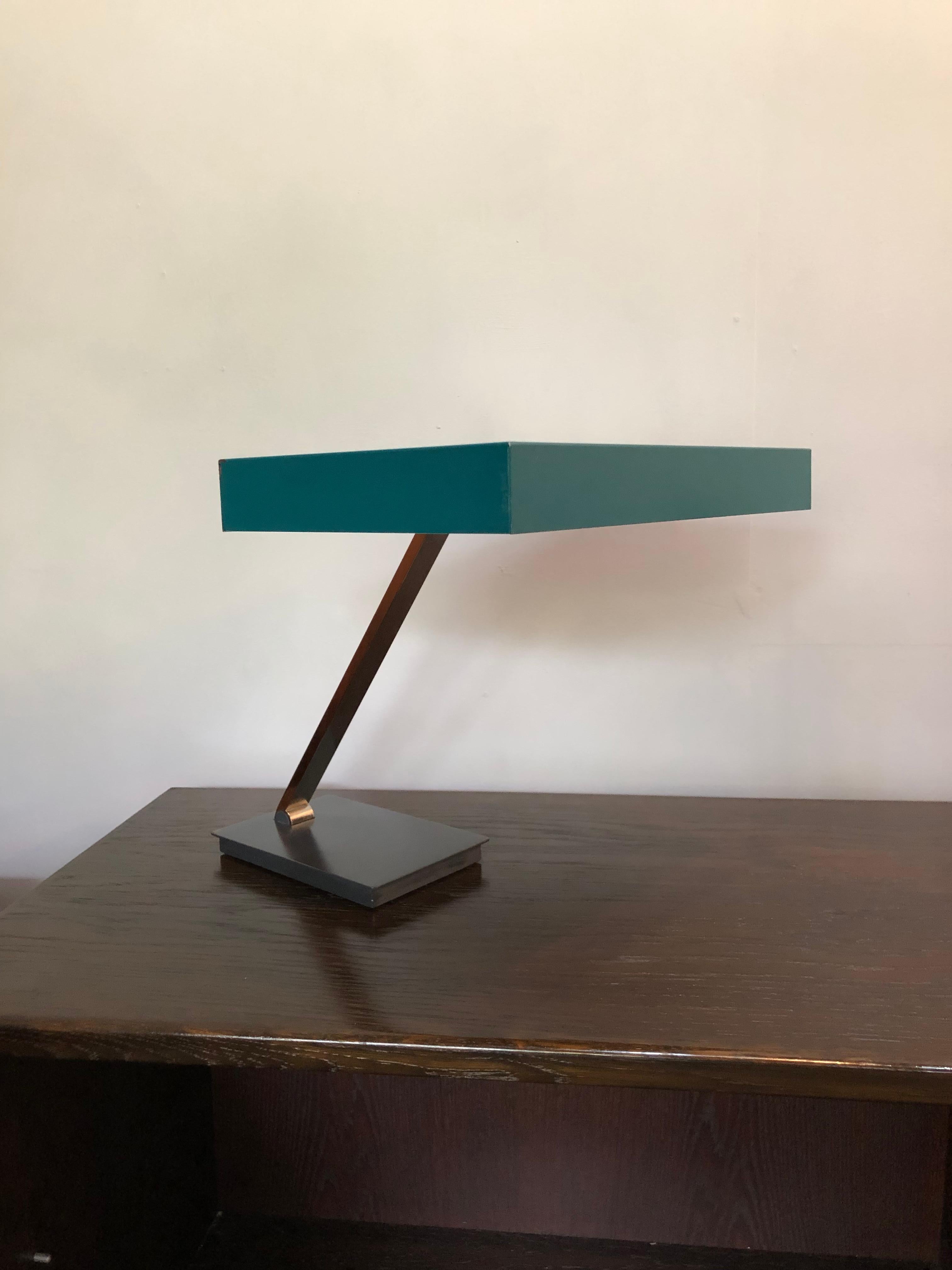Extremely rare Bauhaus Minimalist lamp by Kaiser Leuchten, 1950s. Heavy cast iron base with adjustable chrome stem to the painted steel rectangular hood. Stunning piece of lighting design and a beautiful color. Rewired.