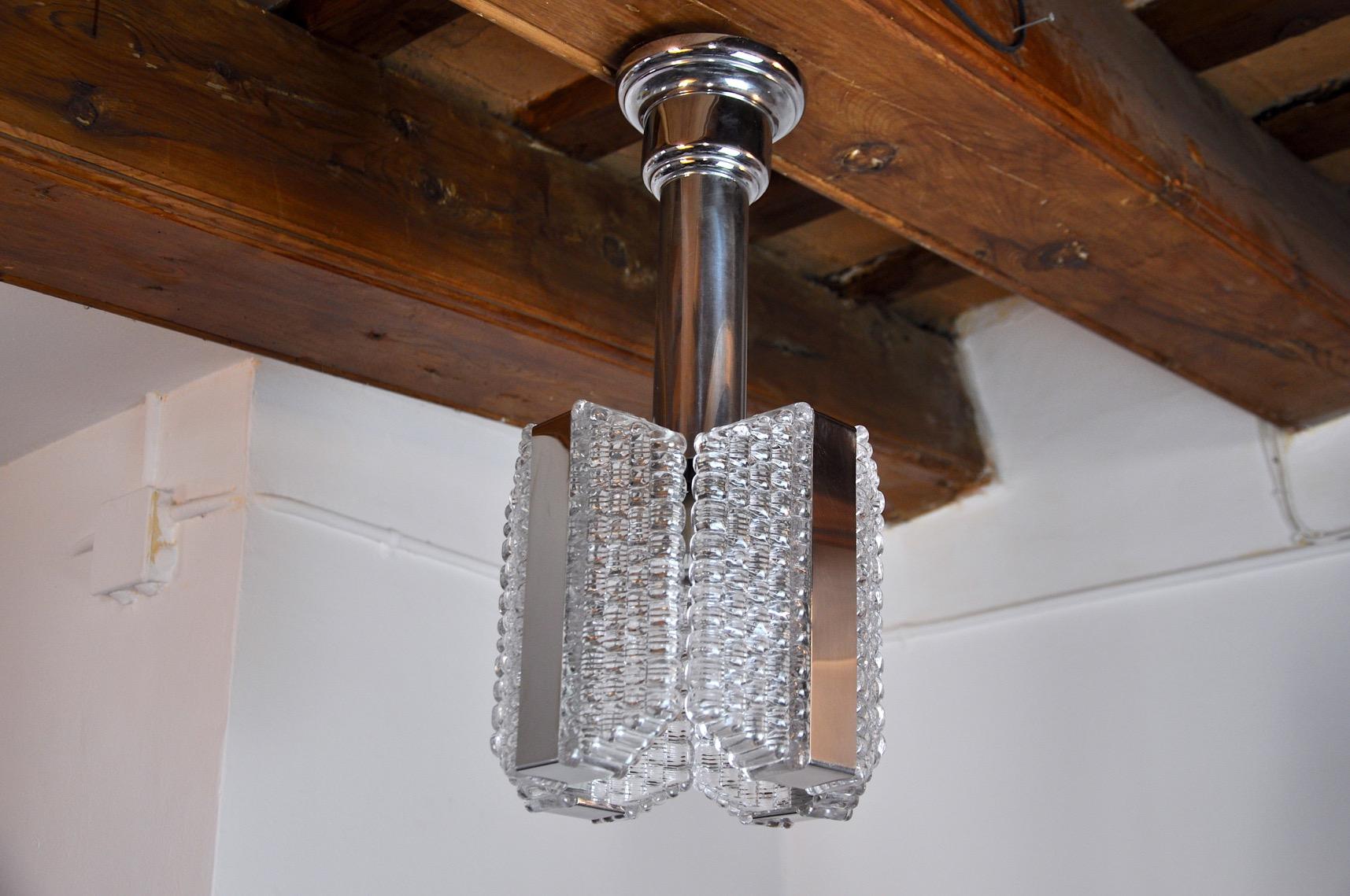 Very beautiful and rare Kaiser Leuchten chandelier designated and produced in Germany in the 1960s. Chromed metal chandelier composed of textured crystals. Rare design object that will illuminate your interior wonderfully. Electricity checked, state