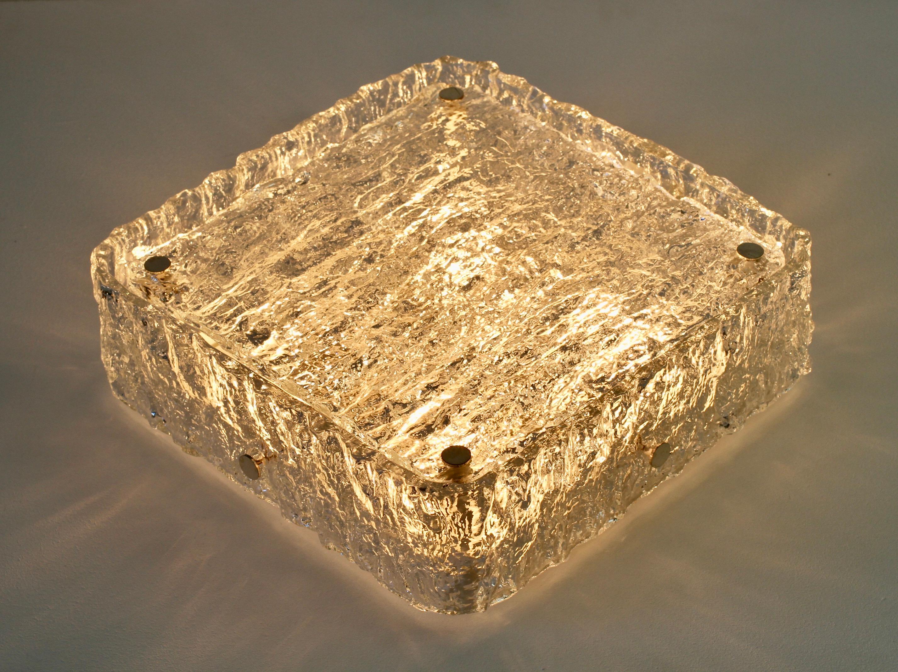 Vintage Mid-Century Modern square 33cm (13 inch) thick textured glass flush mount by Kaiser Leuchten, circa 1960s-1970s. Wonderfully formed 'ice' glass shade of textured structured clear glass. This glass design illuminates beautifully, giving a