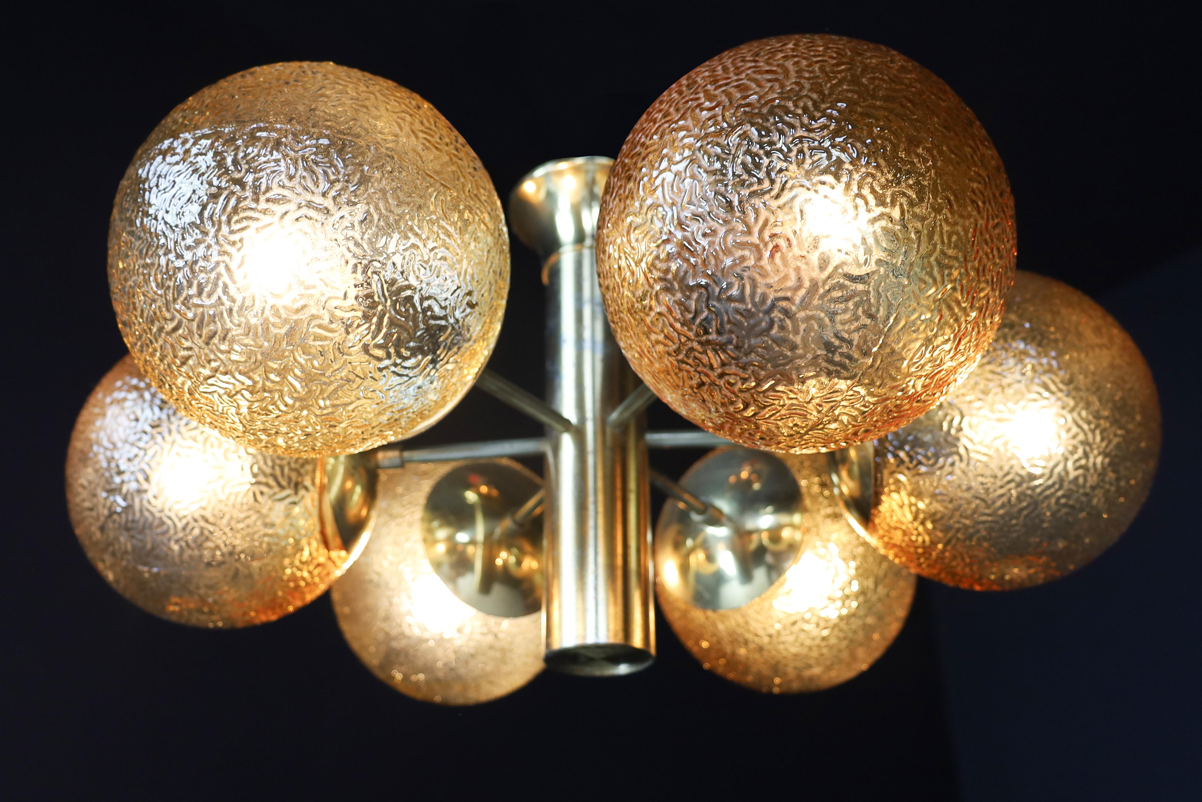 Stunning Sputnik chandelier / flush mount with 6 handmade glass globes and patinated brass by Kaiser Leuchten, Germany, 1960s. This chandelier will contribute to a luxurious character of the (hotel-bar) interior. Very good vintage condition without