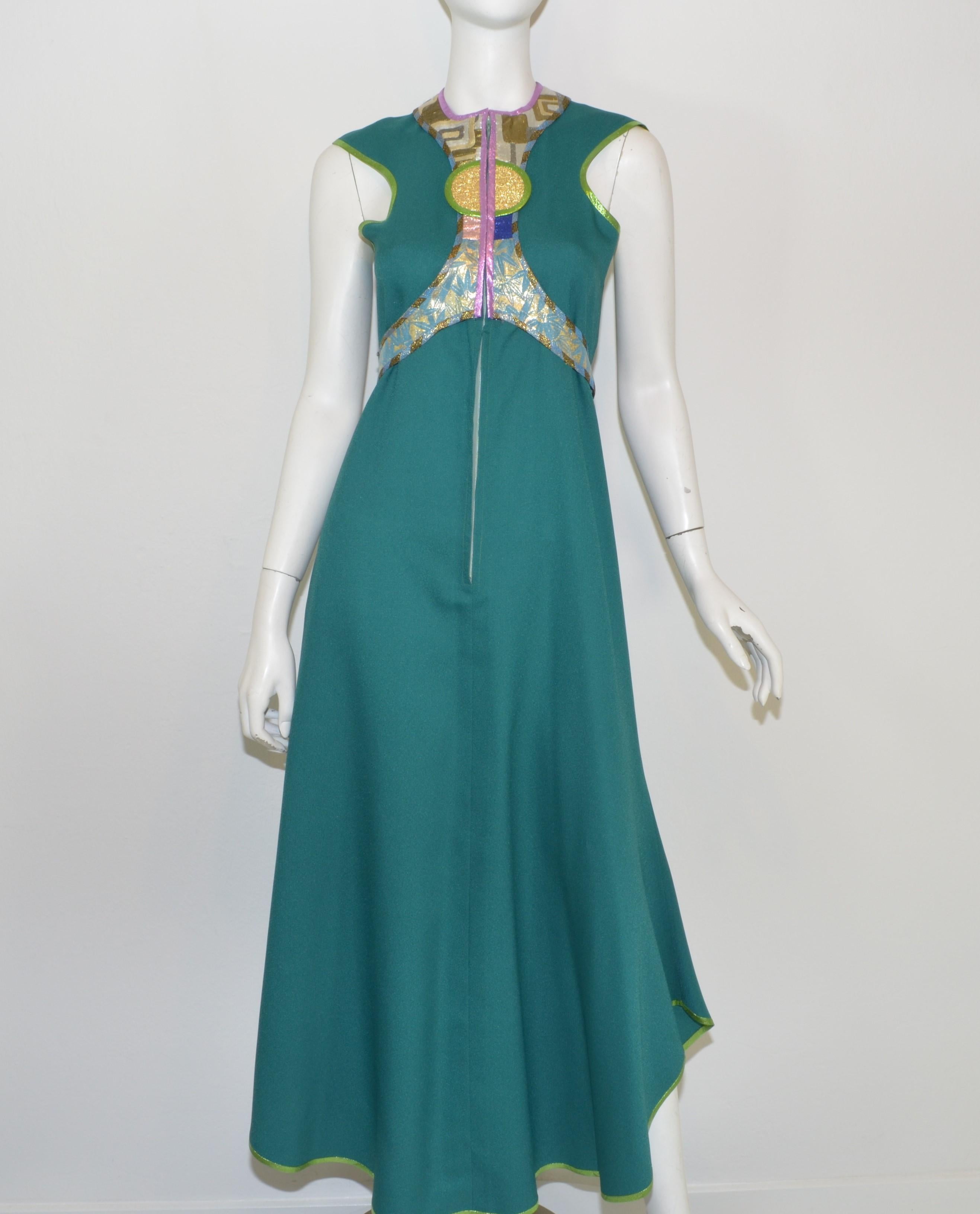 Kaisik Wong Teal Ensemble with Jacket & Dress -- Dress is featured in a teal blue with a metallic lame design along the bust and neckline and a front zipper closure. Jacket has a multicolored lame design along the opening and around the hem with