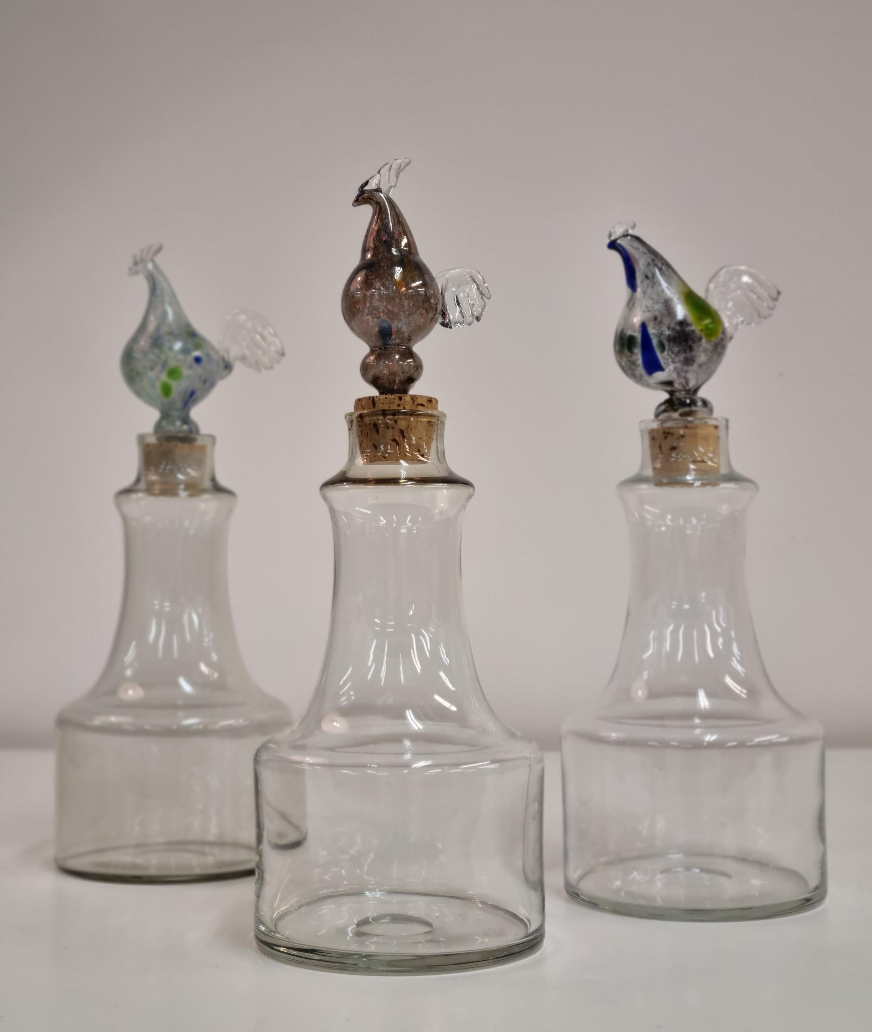 These are beautiful mould-blown glass decanters by the renowned designer Kaj Franck. This object has a distinctive cock stopper on the top, but can be used with or without. This particular series of decanters by Kaj Franck was manufactured for a