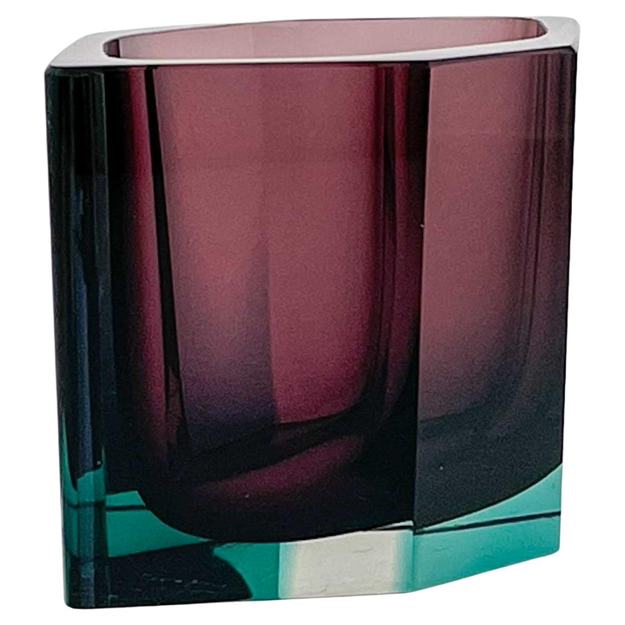A turned mould blown, cased glass, facet cut art-object “Pilari”, model KF 250, in purple and turquoise hues. Designed by Kaj Franck in 1958 and executed by the Nuutajärvi-Notsjö glassworks, Finland in 1959.

These rare hexagonal shaped vases were