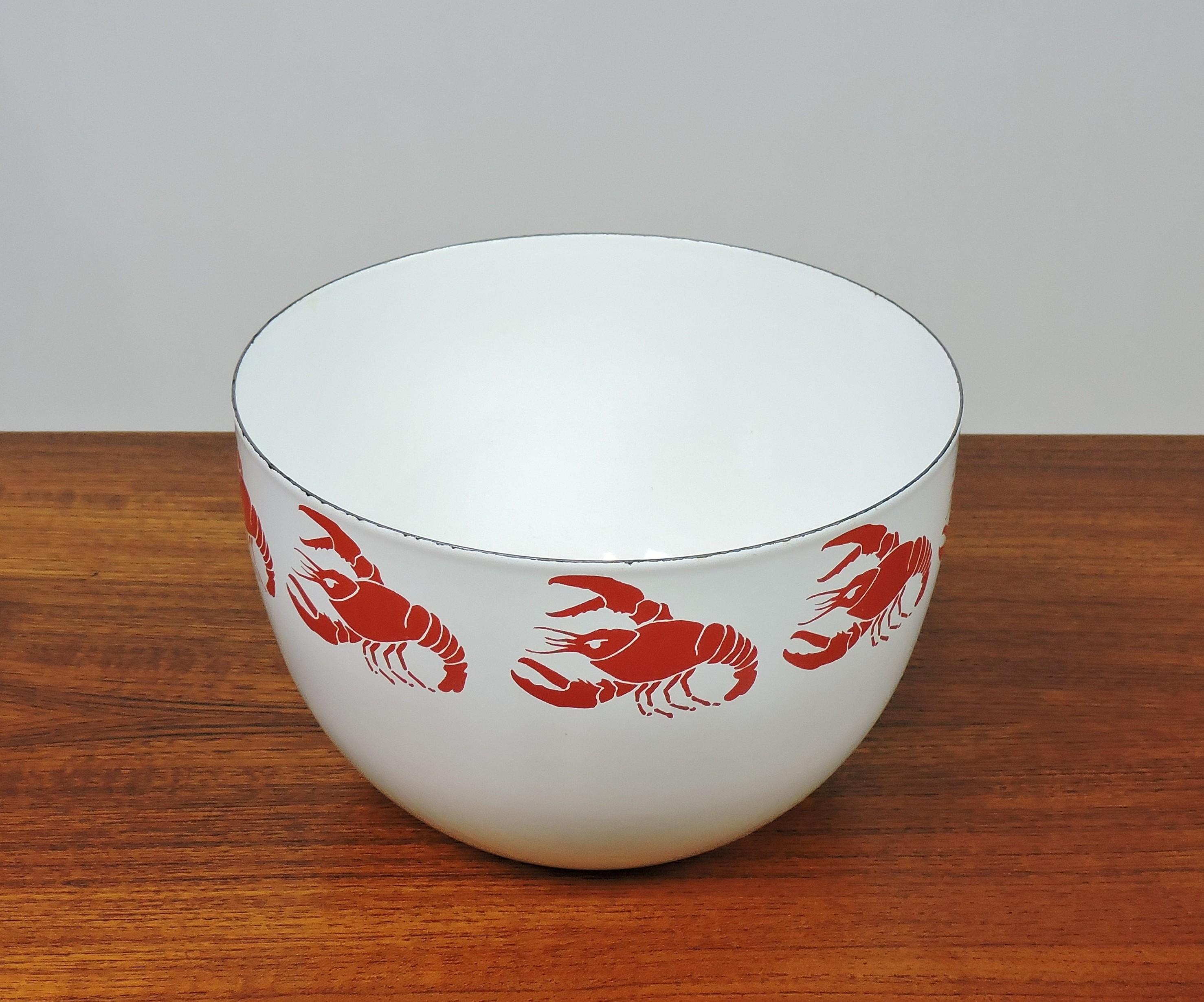 Beautiful enamel on metal bowl by Kaj Franck for Finel Finland. This bowl has a bright red lobster pattern on a white background. A colorful and fun addition to the kitchen!