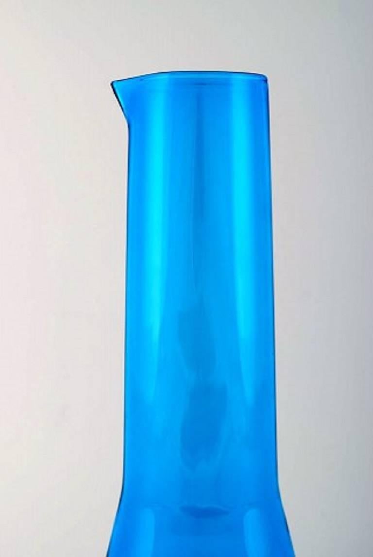 Kaj Franck (Finnish, 1911-1989) Nuutajärvi glass works, Finland, art glass. Pitcher in turquoise art glass.
Finland 1960s-1970s.
In perfect condition.
Measures: 29 cm. x 10 cm.
Unstamped.