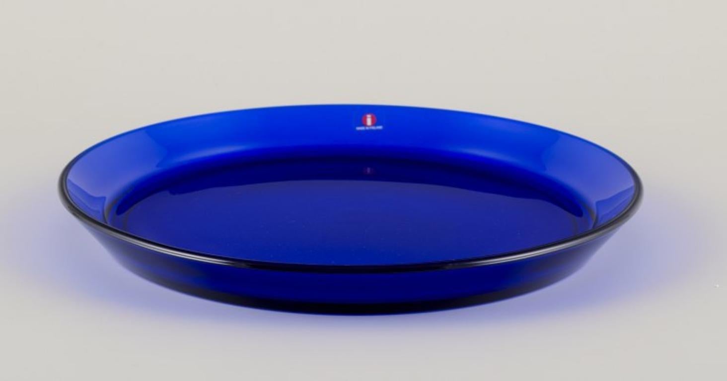 Scandinavian Modern Kaj Franck for Iittala, Finland. Set of eight ‘Kartio’ plates in blue art glass.