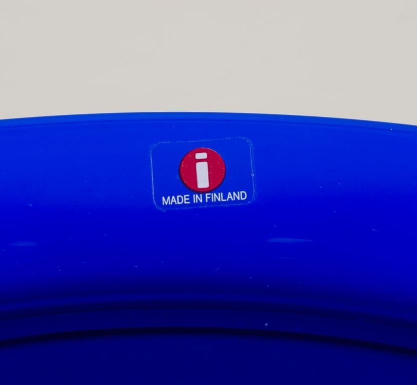 Finnish Kaj Franck for Iittala, Finland. Set of eight ‘Kartio’ plates in blue art glass.