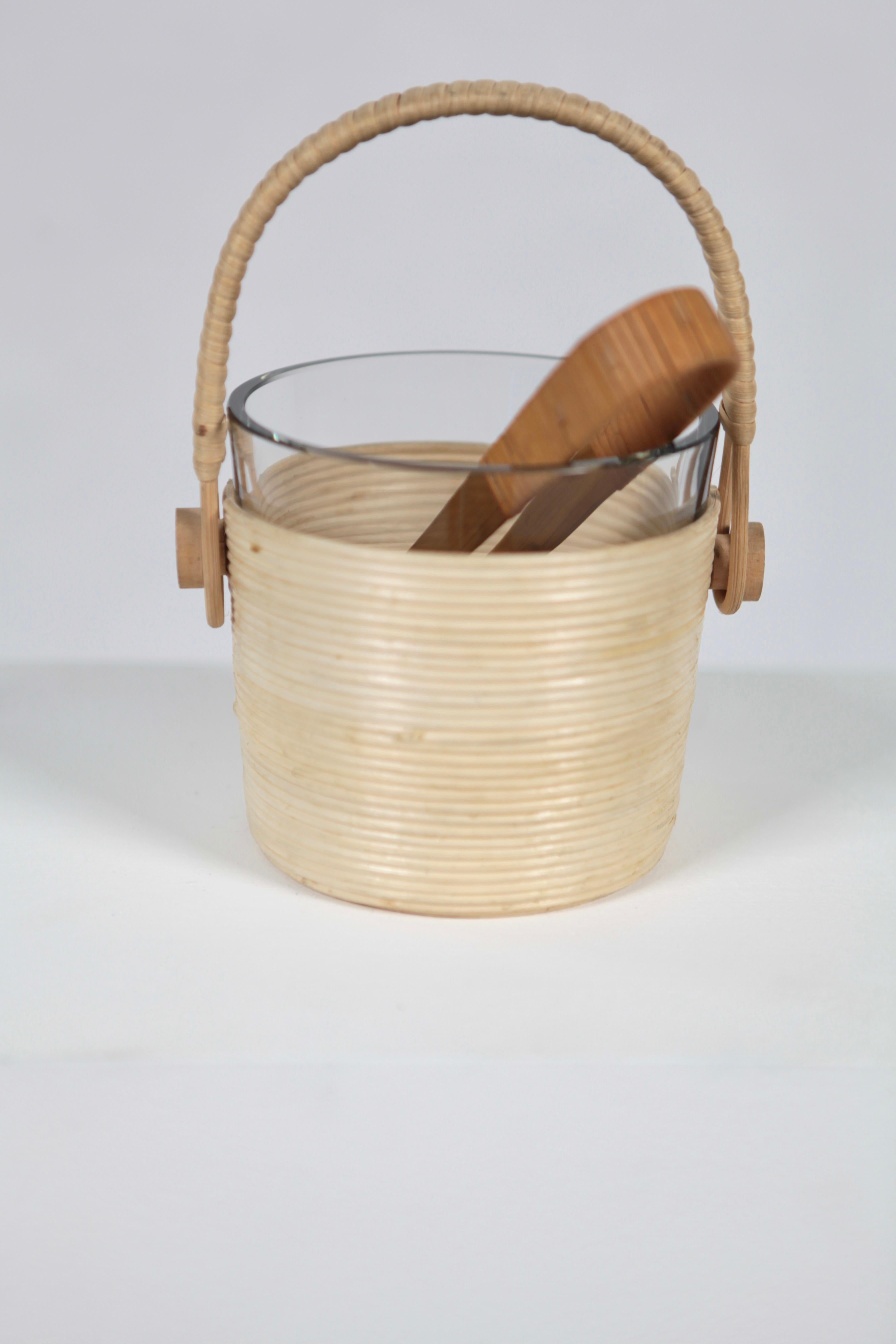 Ice cube cooler or bucket, designed by Kaj Franck.
Manufactured in bamboo, rattan & glass, the ice tong in brass & rattan.
Executed in Finland, 1954.
Excellent condition.