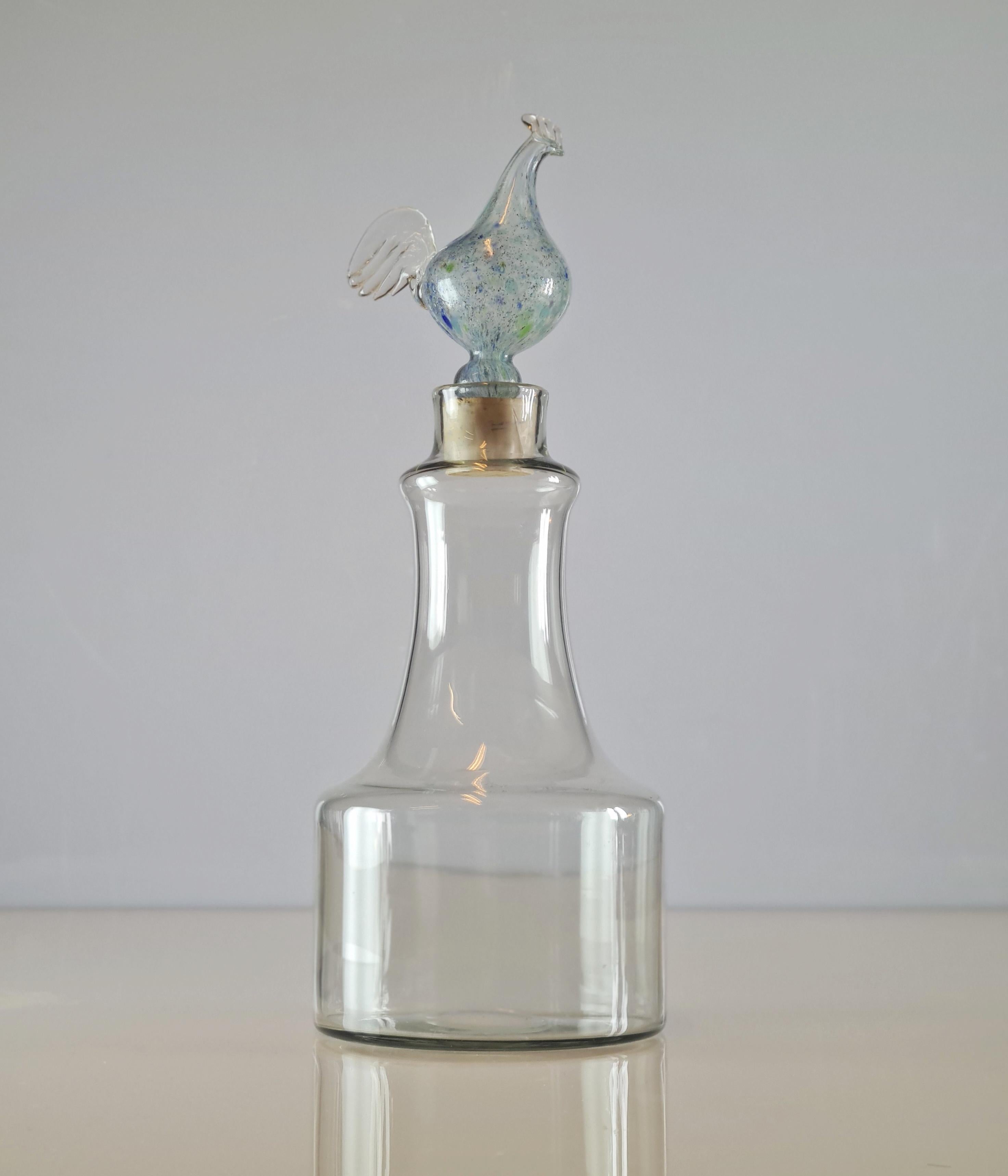A beautiful mould-blown glass decanter by the renowned designer Kaj Franck. This object has a distinctive cock stopper on the top, but can be used with or without. This particular series of decanters by Kaj Franck was manufactured for a limited time