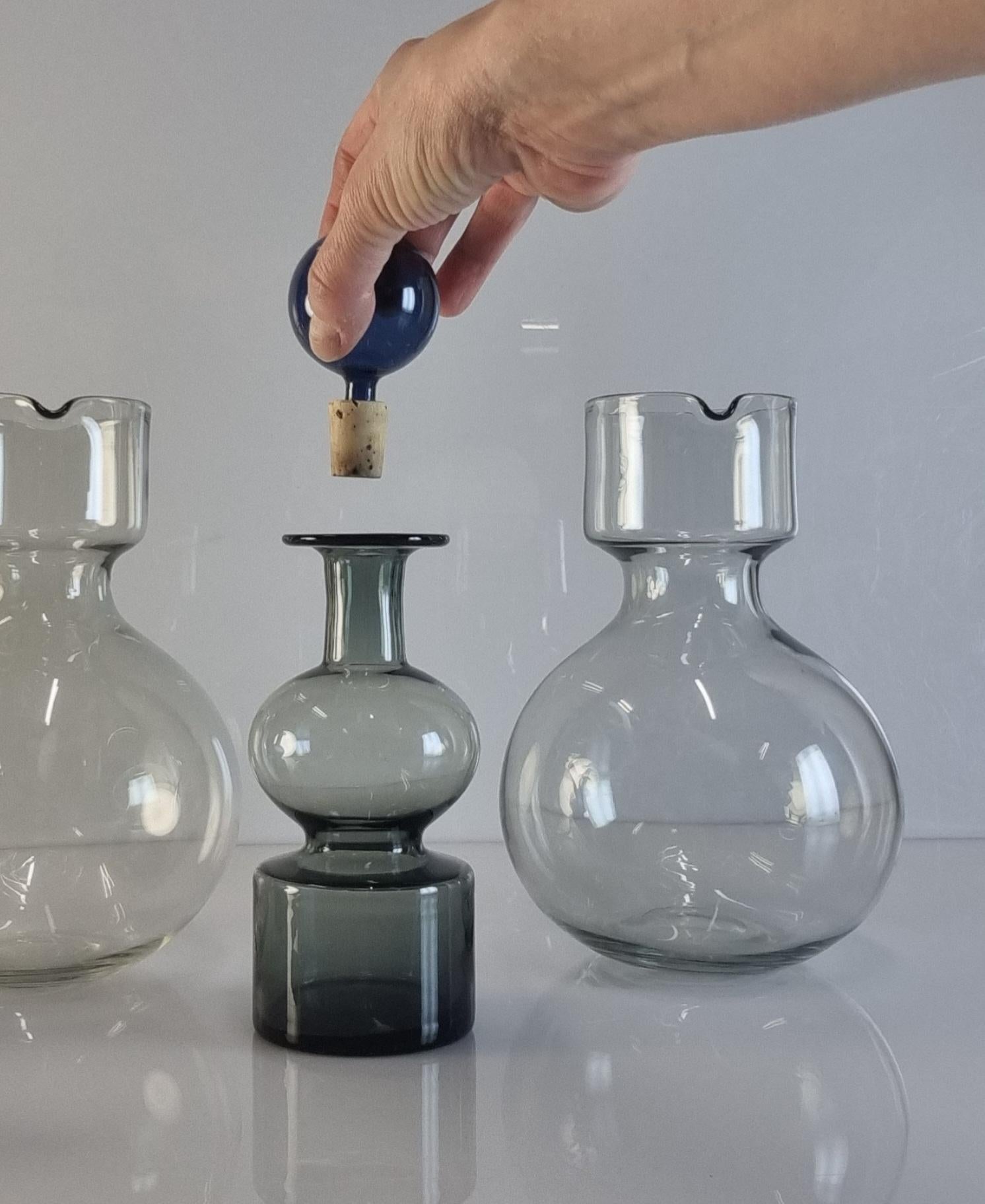 Minimalistic functional beauty.

Designed in the mid 50s, these delicate decorative decanters by Kaj Franck perfectly reflect his school of thought in bringing functionality through beauty to every day items while emphasising minimalism and