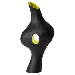 Kakra 0.2, a dark tulip wood sculpture with lime interior by Donald Baugh