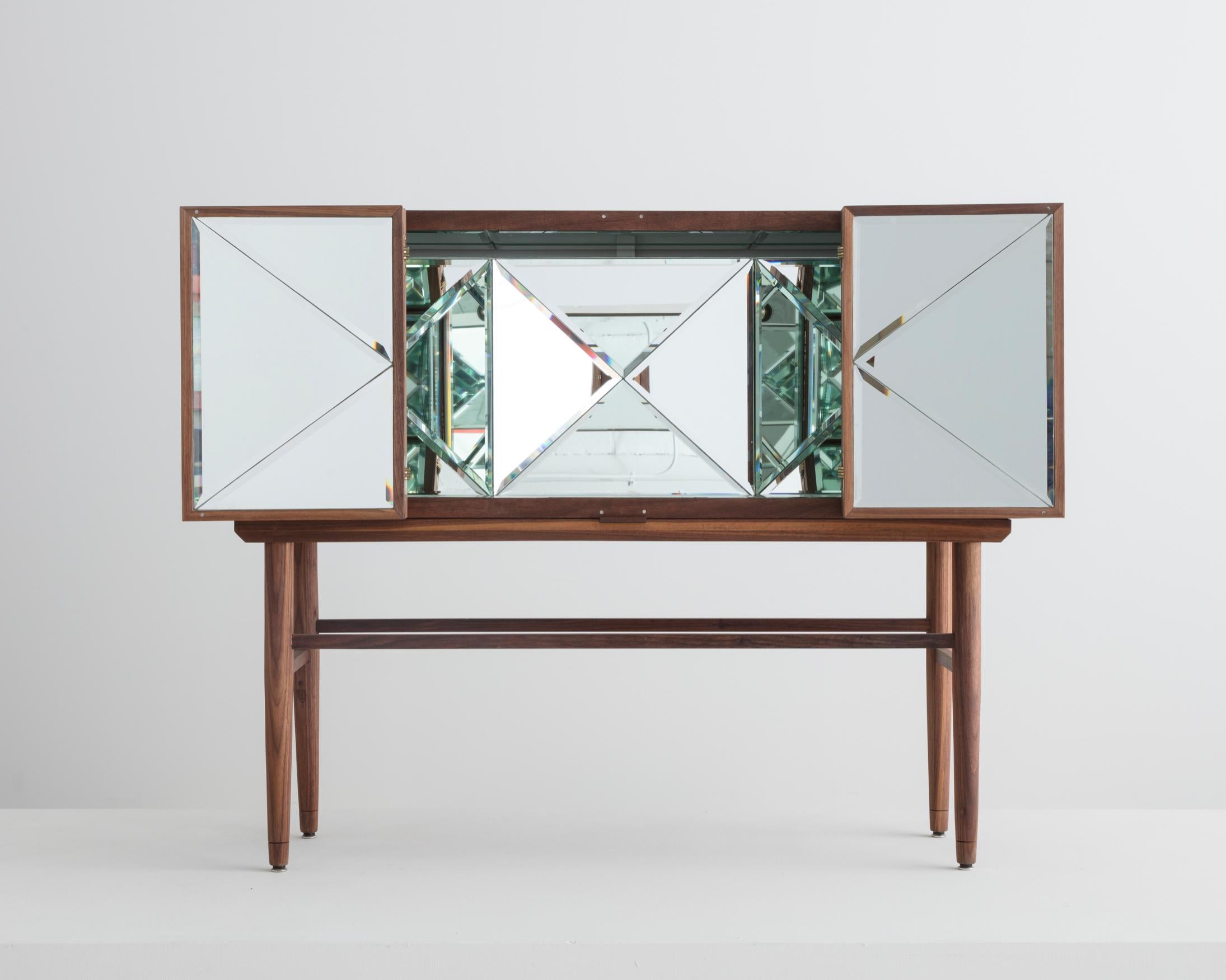 Kaleidoscope cabinet in walnut, mirror, glass, bronze, optical lens, and electric components. Designed by Sebastian ErraZuriz, USA, 2013. This example produced in 2018. Number 4 from an edition of 8 + 2AP.
 