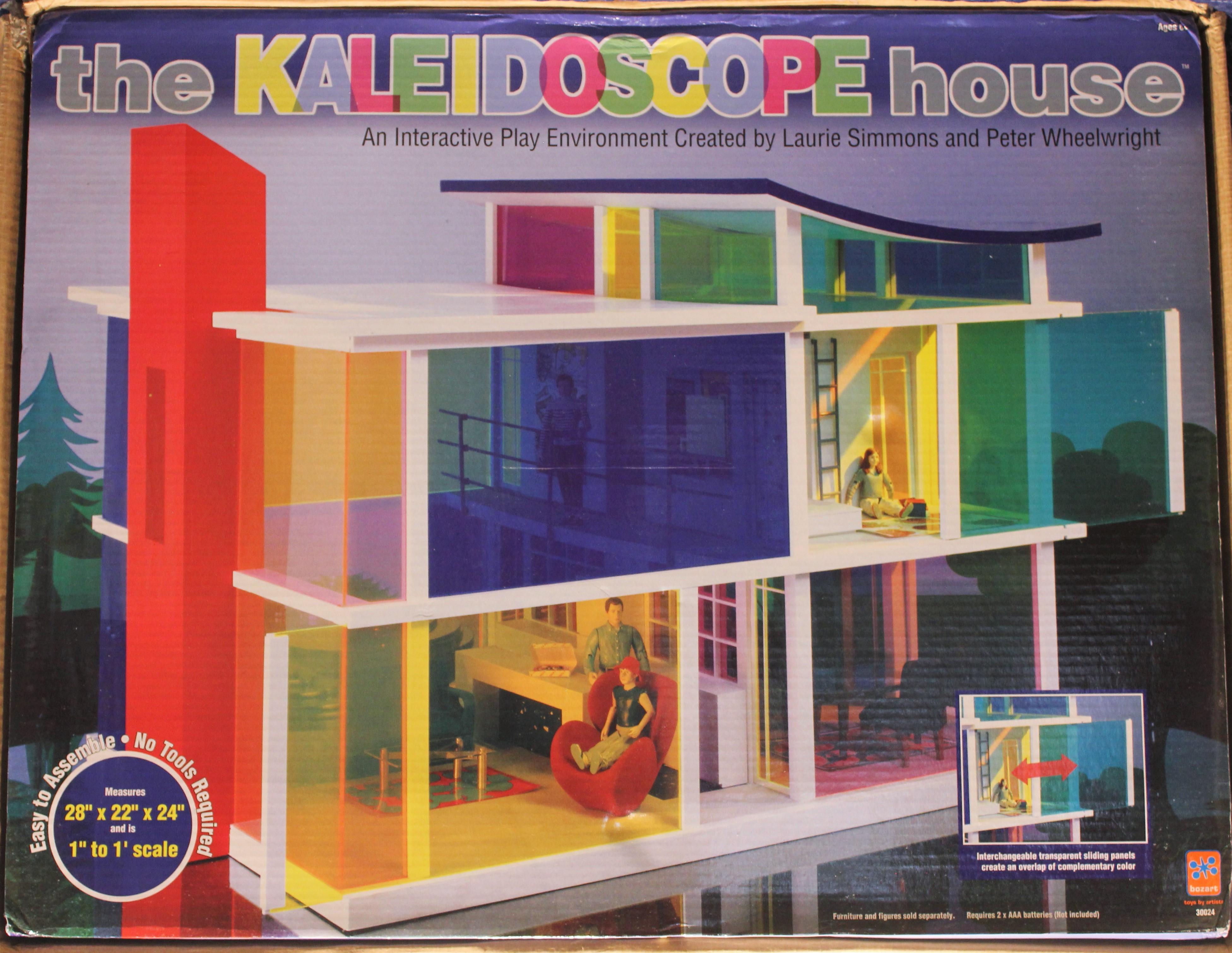 Unopened set of the Kaleidoscope house with opened living room set, unopened bathroom, dining room, bedroom, and art collection #1. 

The Kaleidoscope House, a collaborative project with Bozart Toys which produces toys with leading contemporary