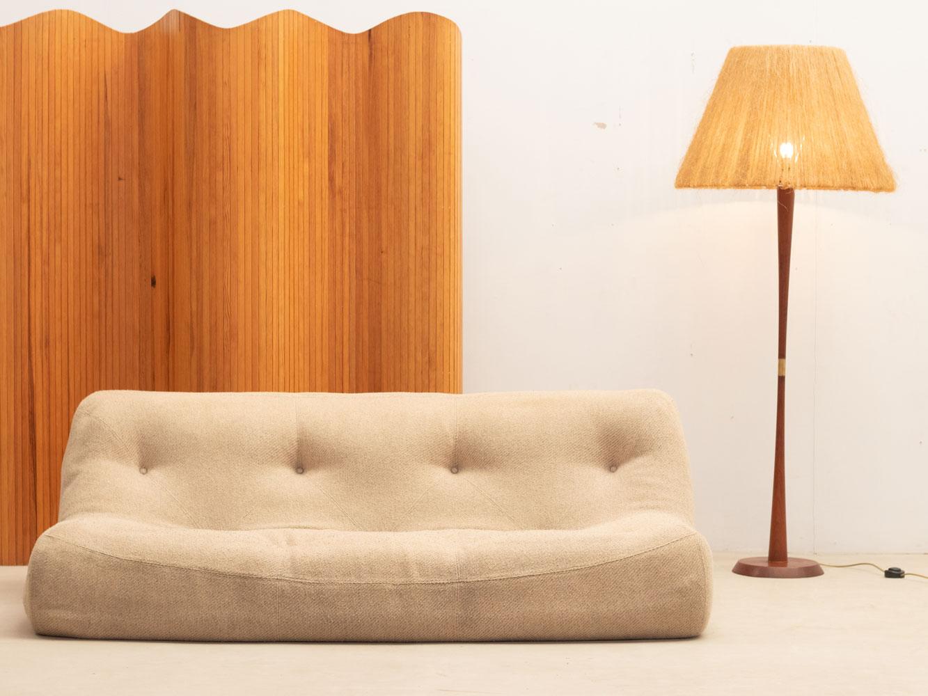 This 3-seater sofa was designed by Michel Ducaroy for Ligne Roset in the 1970s. Its design and composition align with the Togo series.

The sofa is entirely made of foam and is covered with its original upholstery.

Good vintage overall condition,