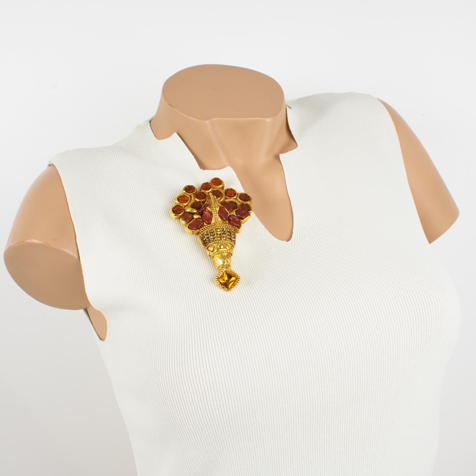 This lovely Kalinger Paris pin brooch features a massive dimensional bunch of flowers made of gold-plated coated resin, all carved and textured and ornate with resin cabochons and crystal rhinestones. The pin boasts burnt orange, red rust, and