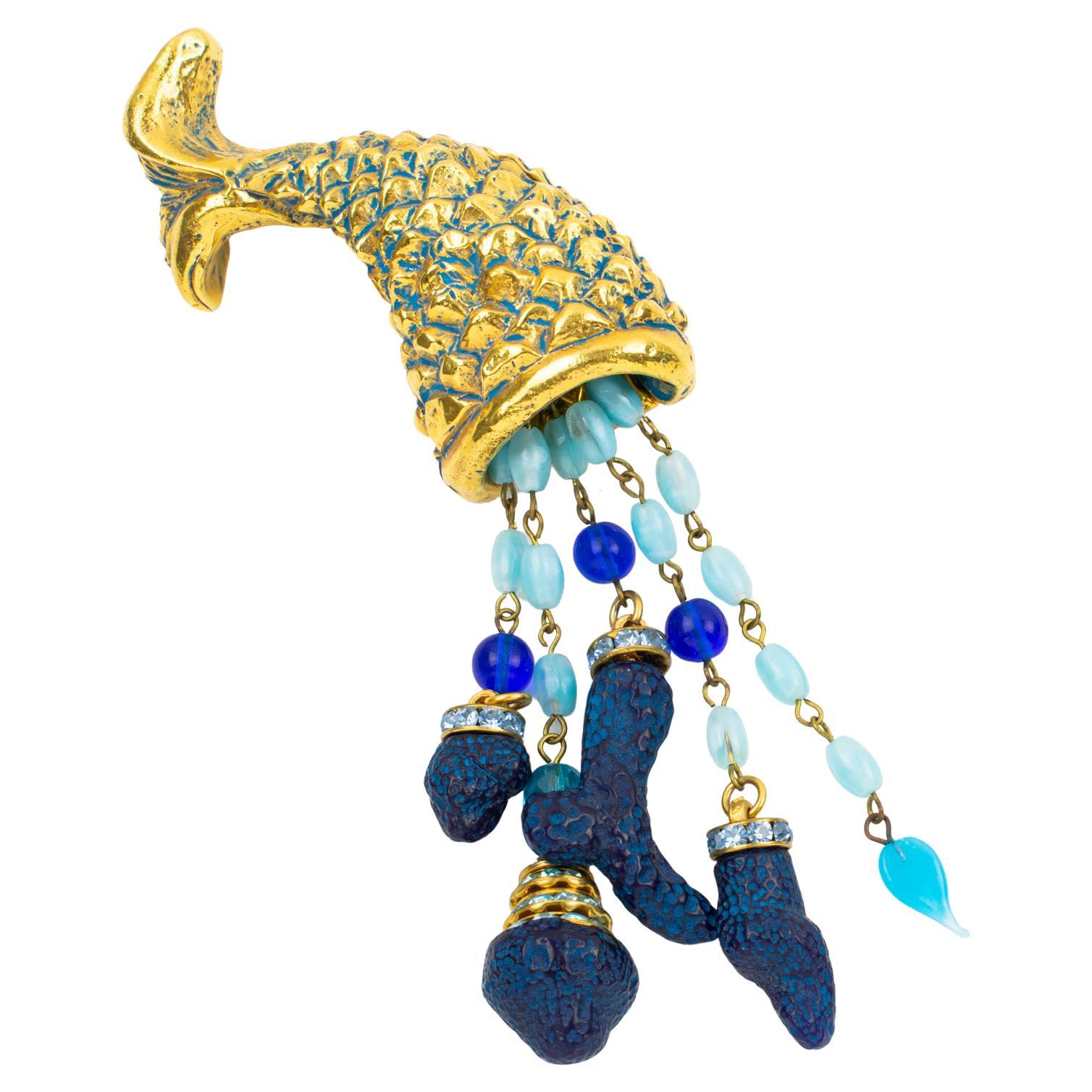 This gorgeous Kalinger Paris romantic pin brooch features a dimensional oversized nautical horn of plenty, made of gold-plated coated resin, all carved like a fishtail and body and ornate with extra-long dangling charms. The charms are made of