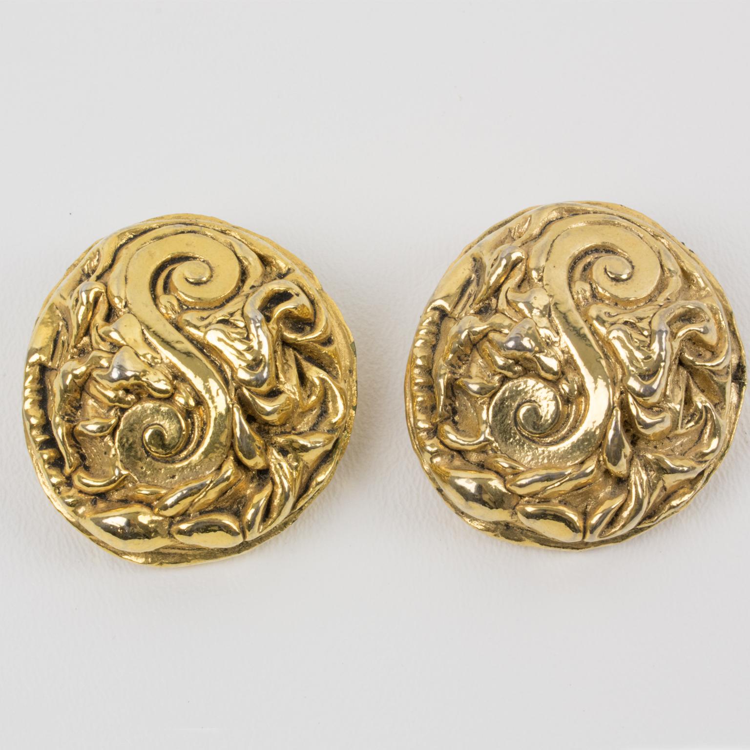 These stunning Kalinger Paris oversized clip-on earrings feature a round-domed shape with an intricately carved gilt-metal-coated resin cameo. The pieces are marked on the clip: 