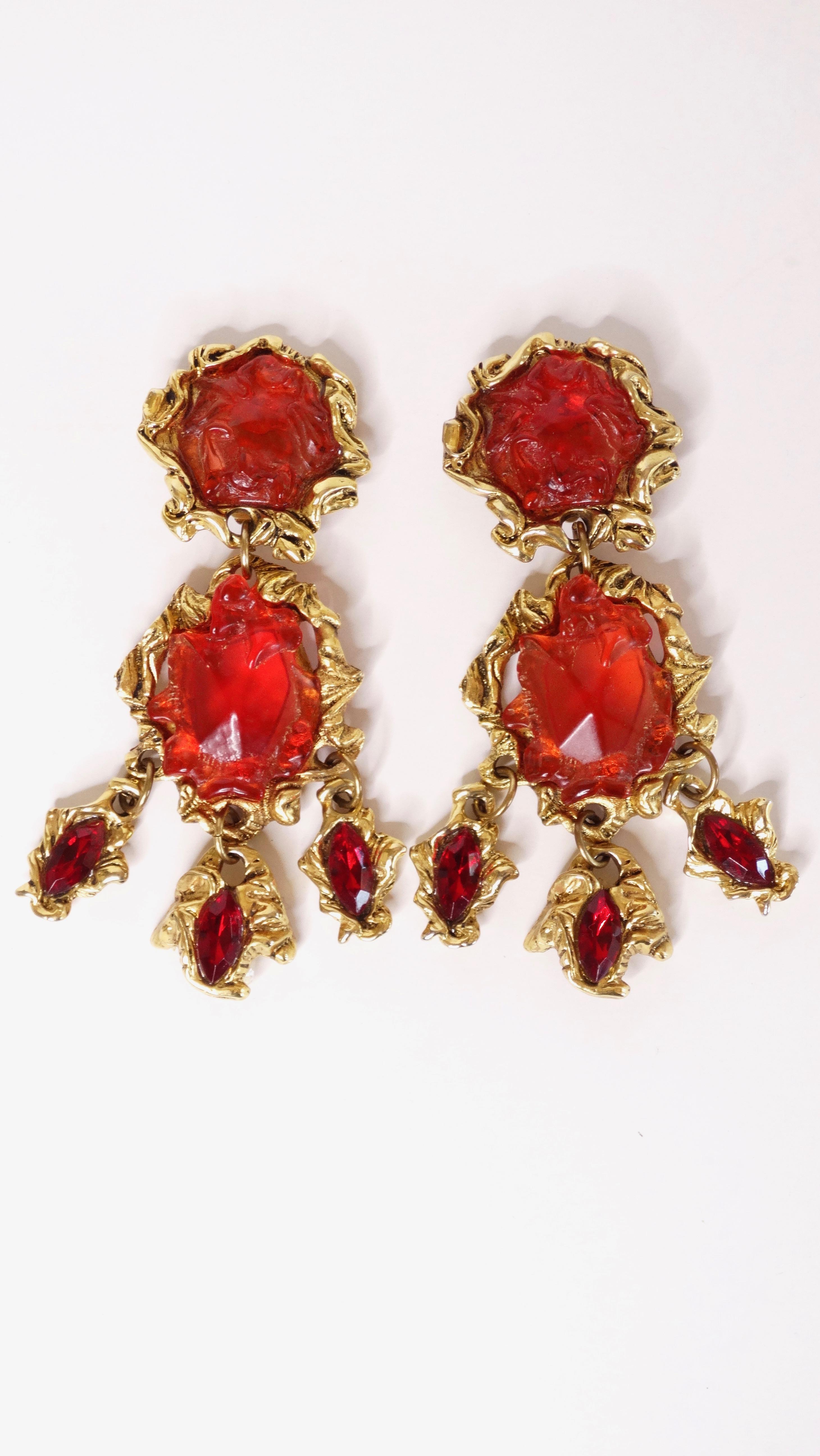 A fabulous 1980's Kalinger Paris couture runway earrings with the perfect hue of red! If you love a chunky/long earring and of course to make a statement, these are the earrings for you. Earrings are plated gold with resin crystal cut gems.