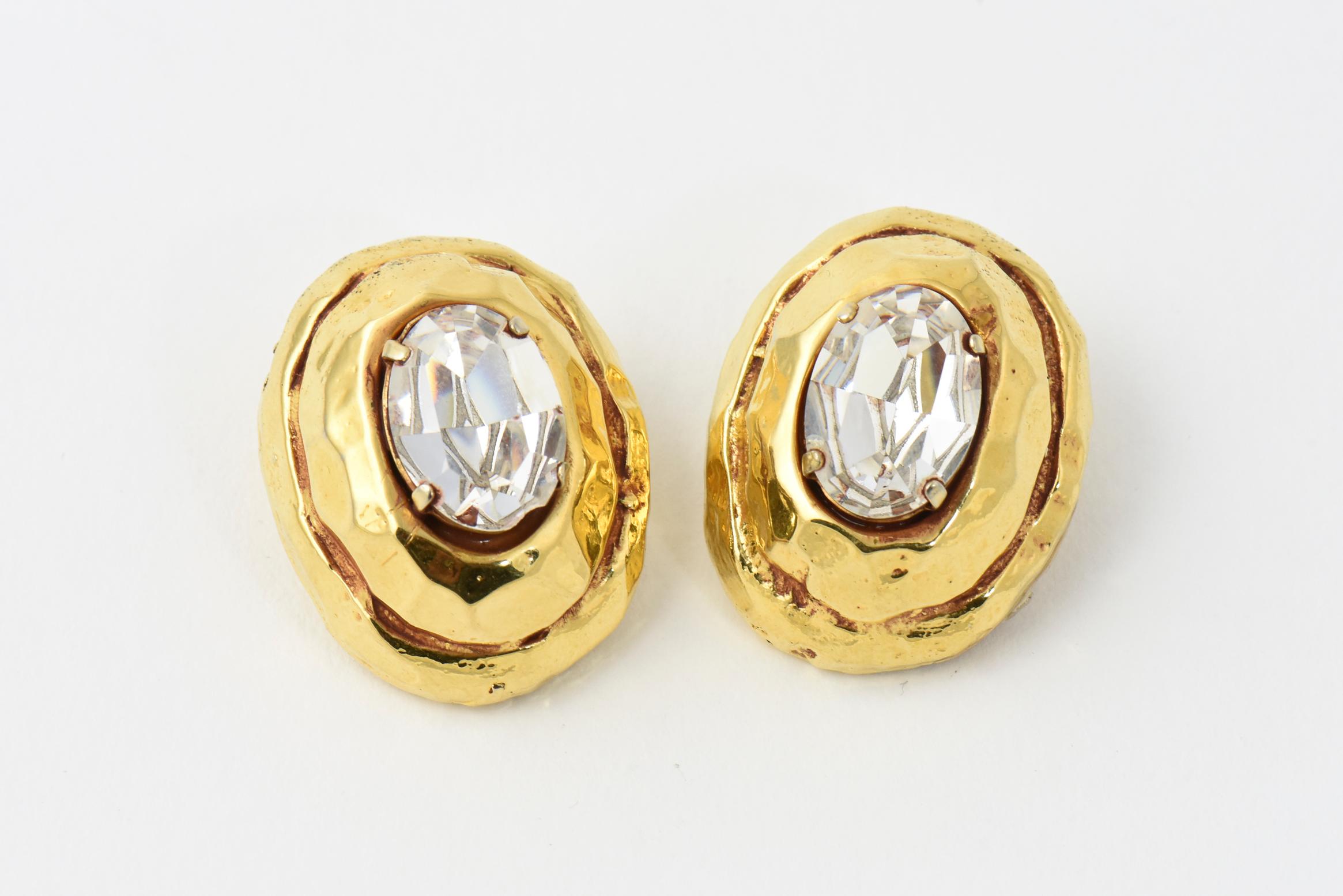Kalinger Paris hammered goldtone earrings with large oval Swarovski crystal centers, circa 1985. Signed Kalinger Paris. Clip backs.
