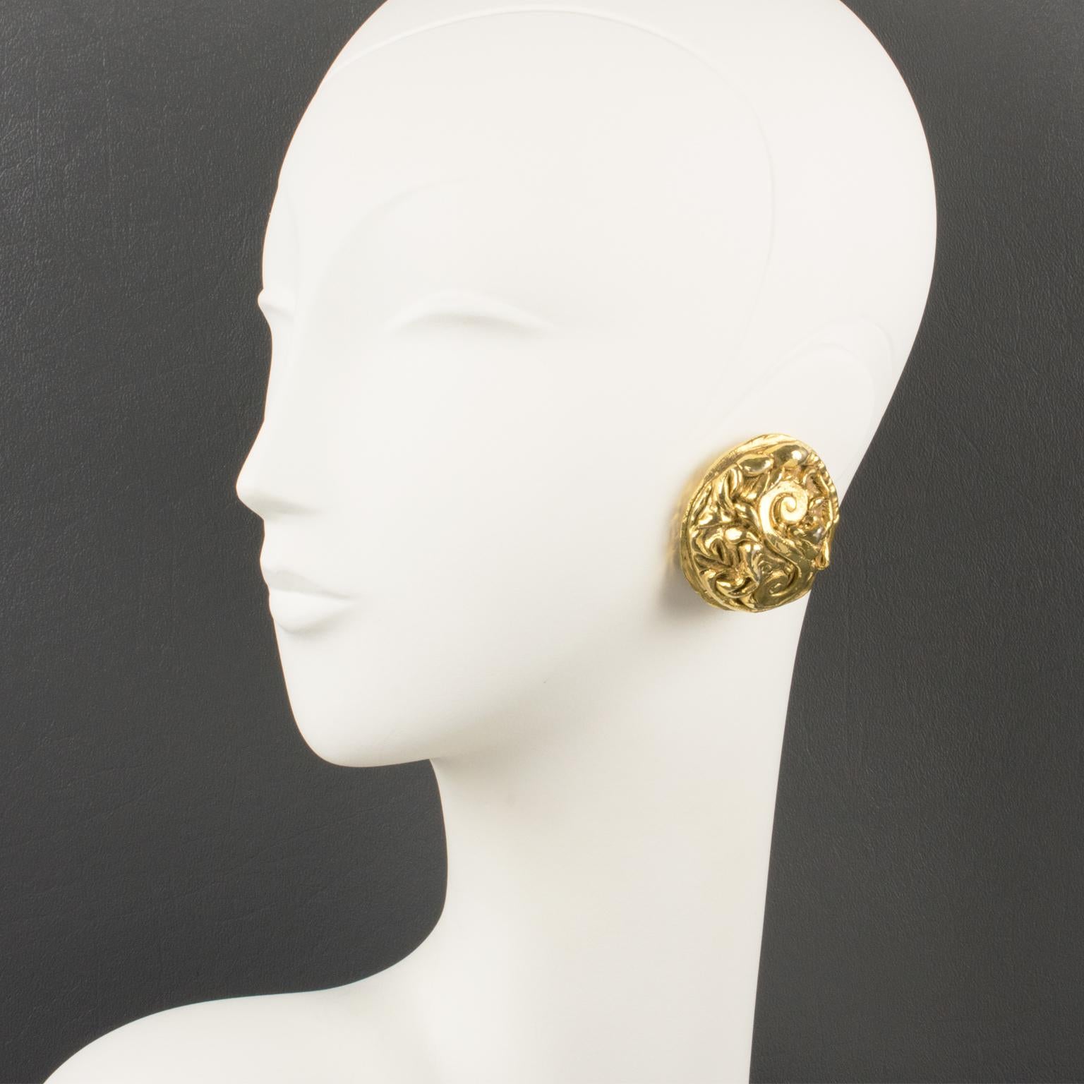 Stunning Kalinger Paris oversized clip-on earrings. Round-domed shape featuring a large gilt-metal coated resin cameo with intricately carved design. Marked on the clip: 
