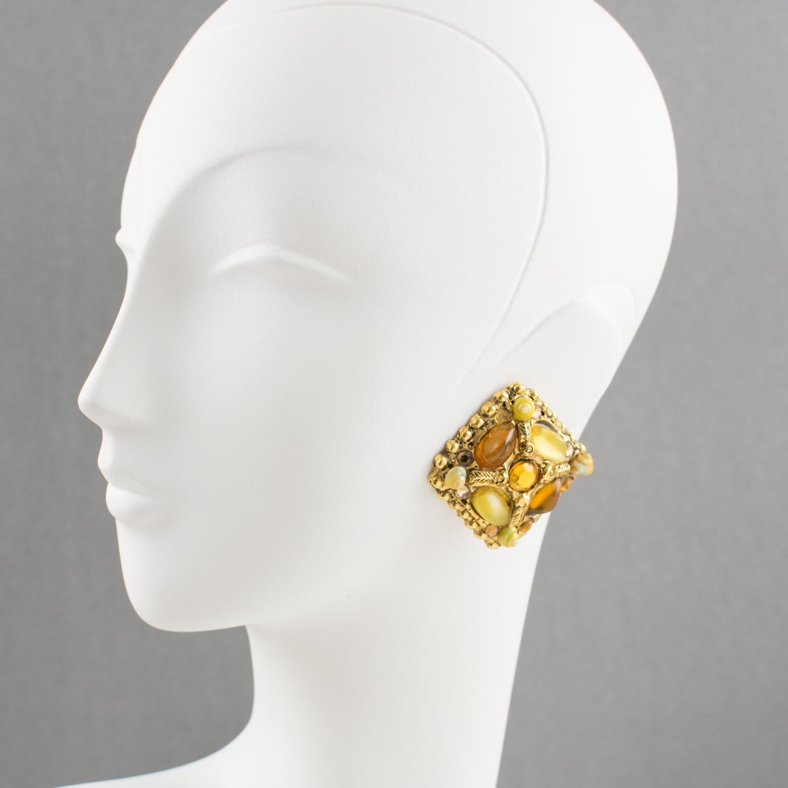 Very attractive Kalinger Paris clip-on earrings. Oversized gilt metal-coated resin with a geometric shape all carved and textured topped with real tiny seashells, sunny resin cabochons, and glass rhinestone. Assorted colors of milky lemon, yellow