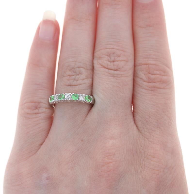 Retail Price: $1,060

Size: 6 3/4
Sizing Fee: Down 1 for $30 or up 2 for $35

Brand: Kallati

Metal Content: 9k White Gold

Stone Information
Natural Tsavorite Garnets
Carat(s): .43ctw
Cut: Round
Color: Green

Natural Diamonds
Carat(s): .20ctw
Cut: