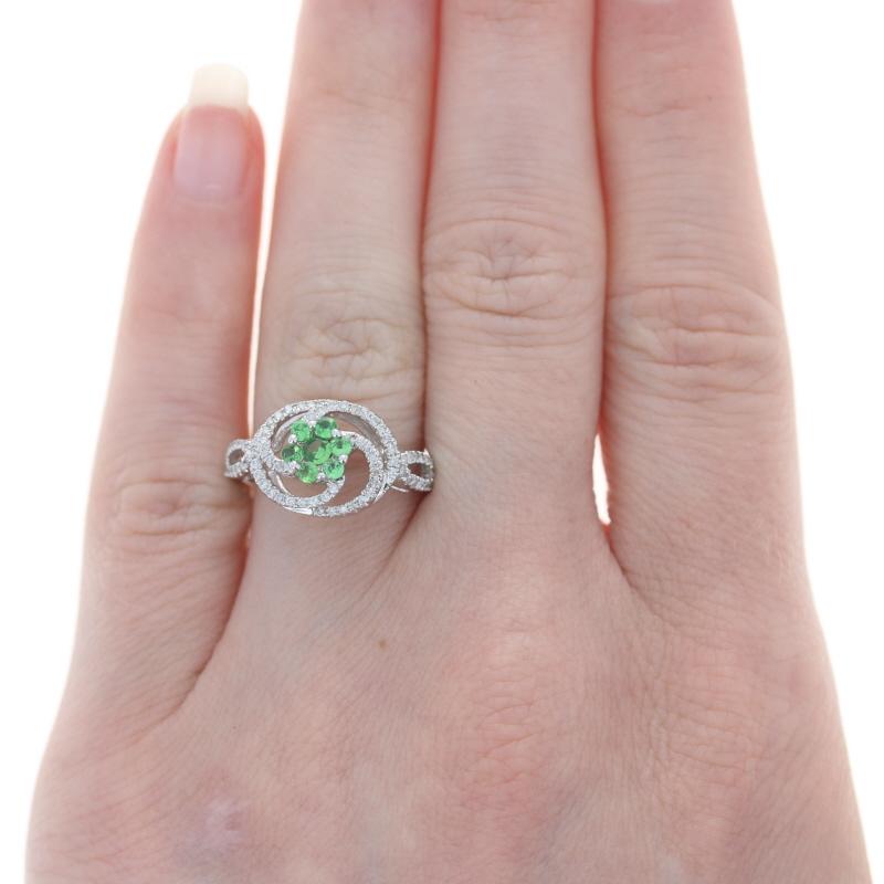 Retail Price: $2,000

Size: 7
Sizing Fee: Up 2 for $35

Brand: Kallati

Metal Content: 9k White Gold

Stone Information
Natural Tsavorite Garnets
Carat(s): .26ctw
Cut: Round
Color: Green

Natural Diamonds
Carat(s): .30ctw
Cut: Round Brilliant
Color: