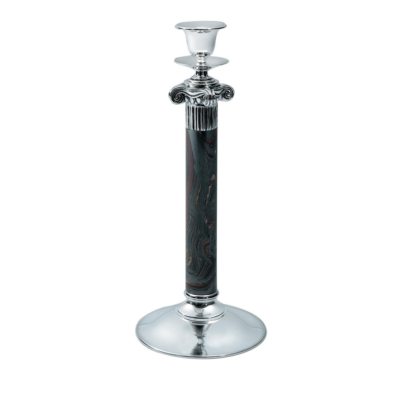 This sophisticated candleholder is composed of a polished silver round base and a stem made of tiger iron, while the Ionic-order capital that supports the silver bobeche and cup is crafted using the lost wax casting technique. Part of the Kallicrate