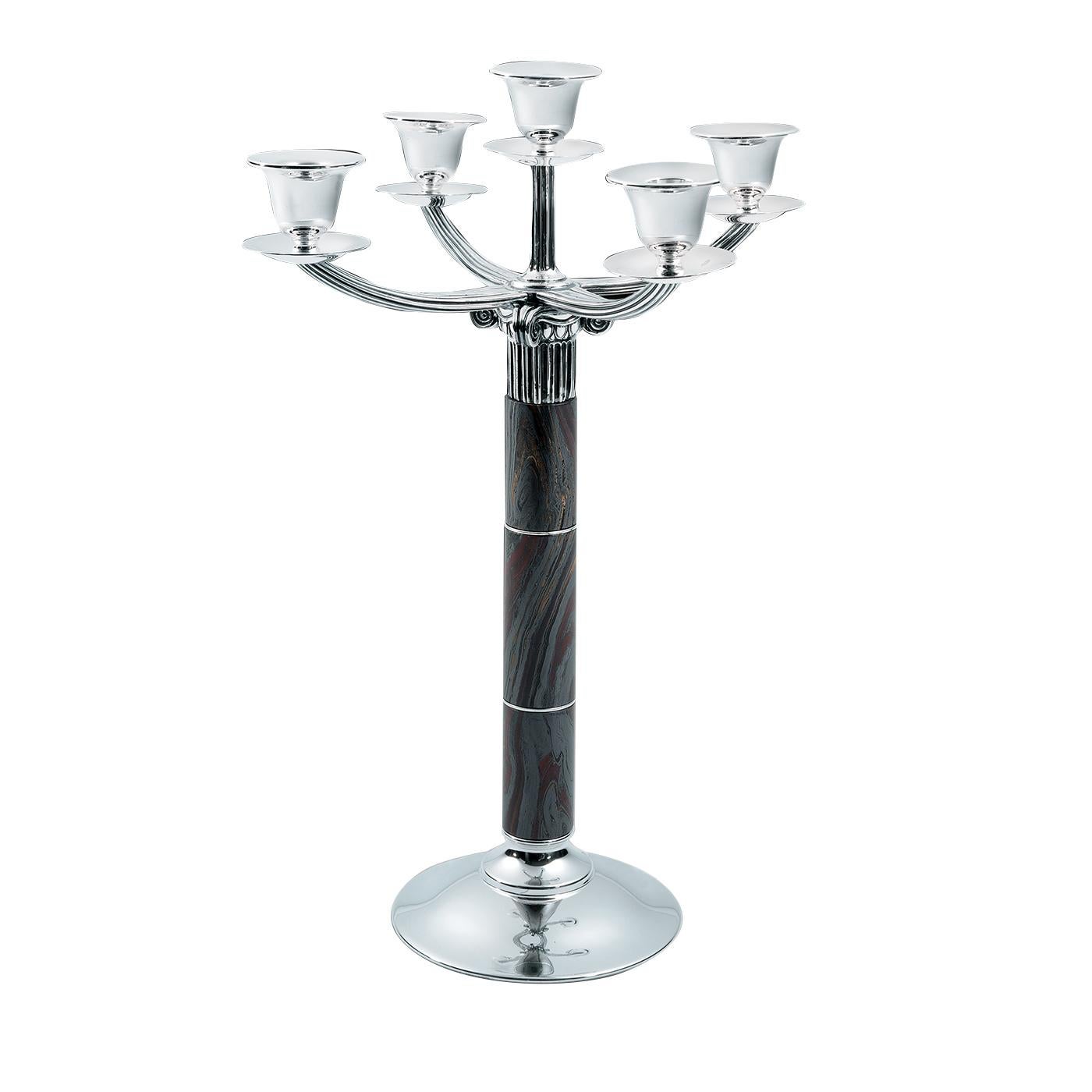 Harmoniously merging classical elements of the Greek architecture and fluid, contemporary shapes, the Kallicrate collection is characterized by pieces that are sophisticated yet versatile. This striking candelabrum is supported by a round base with