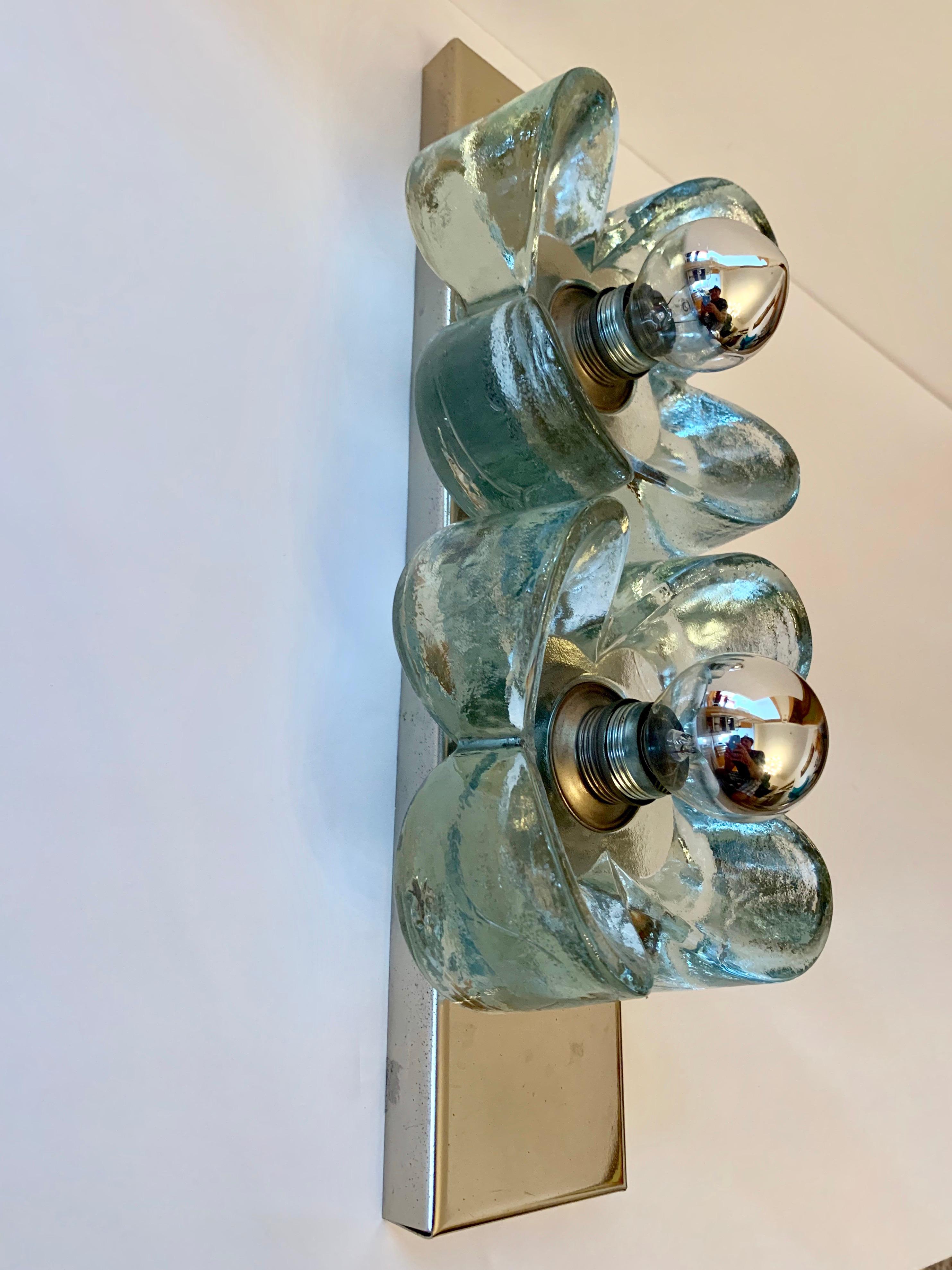 A two light chrome wall light with two thick crystal glass decorative flowers. Rewired.