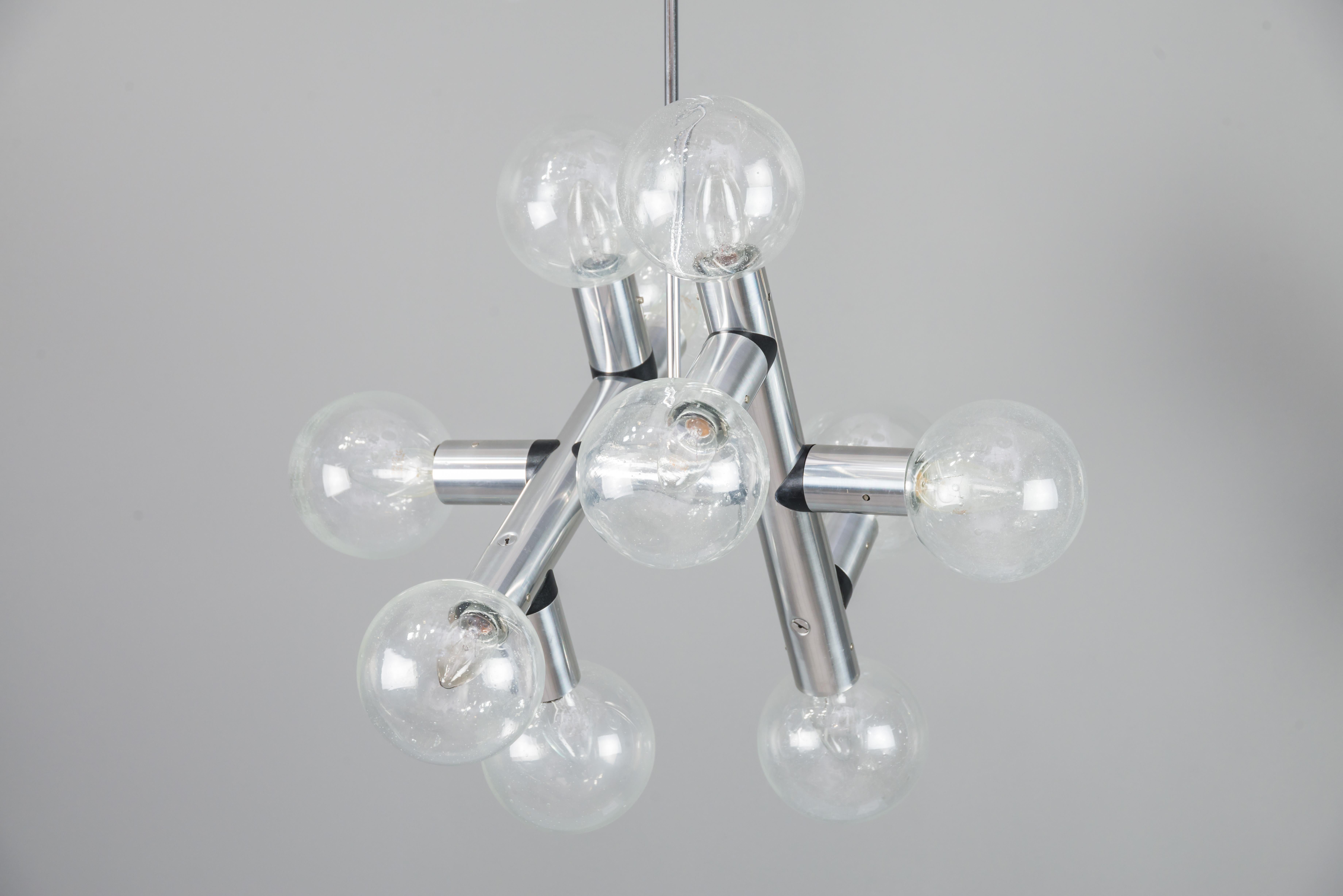 Kalmar atomic ceiling lamps chandeliers, 1960s
designed and executed by Kalmar Vienna in 1969.
Made of nickel-plated metal with nice ball lampshades made of clear class with small bubbles.
10 glass balls
Original condition.
 